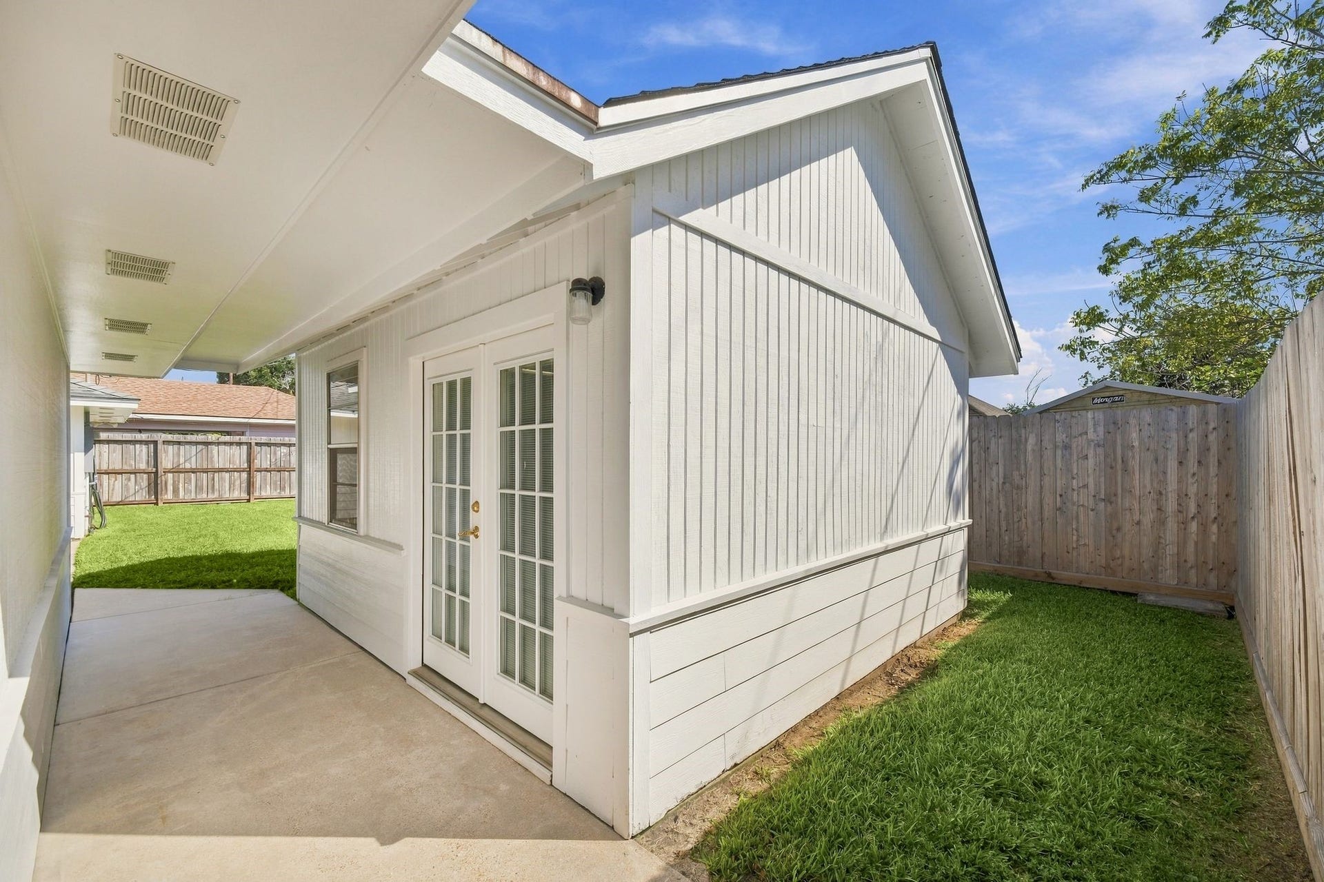 5125 Nina Lee Lane, Houston, TX 77092 Versatile space perfect for a man-cave or home office, featuring a quick-cooling window unit.