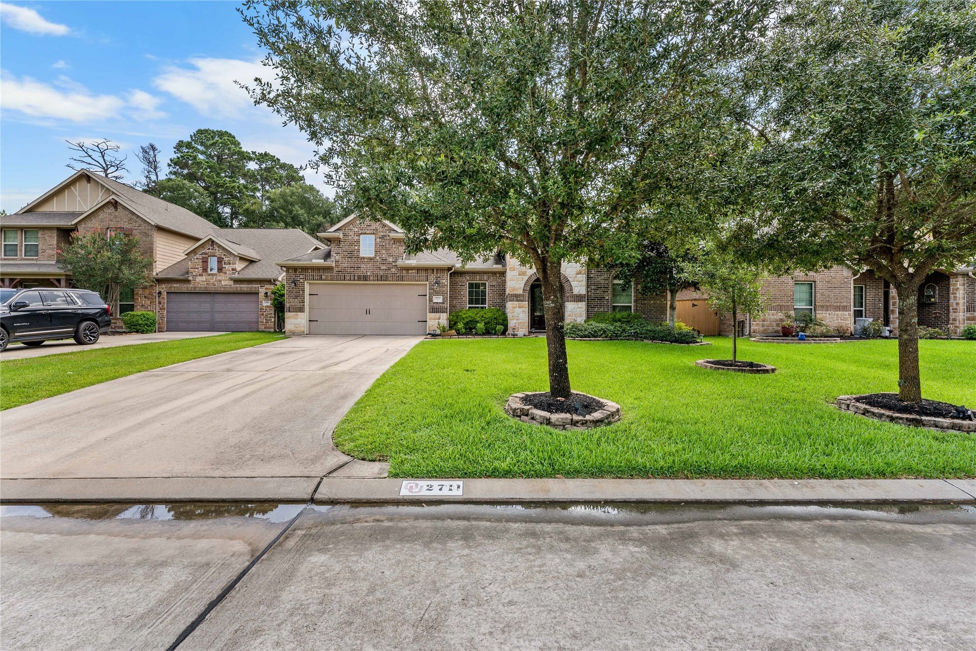 Front streetscape highlighting mature landscaping and neighborhood setting.
