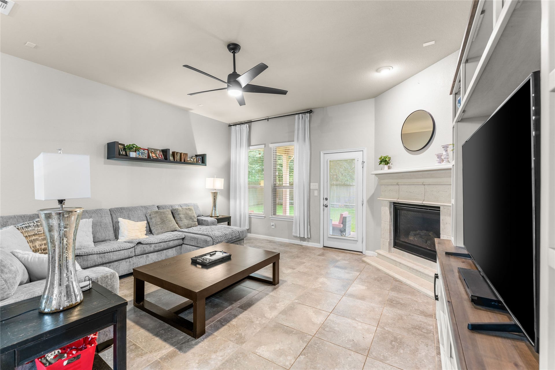 Open living area with soaring ceilings, fireplace, and comfortable flow.