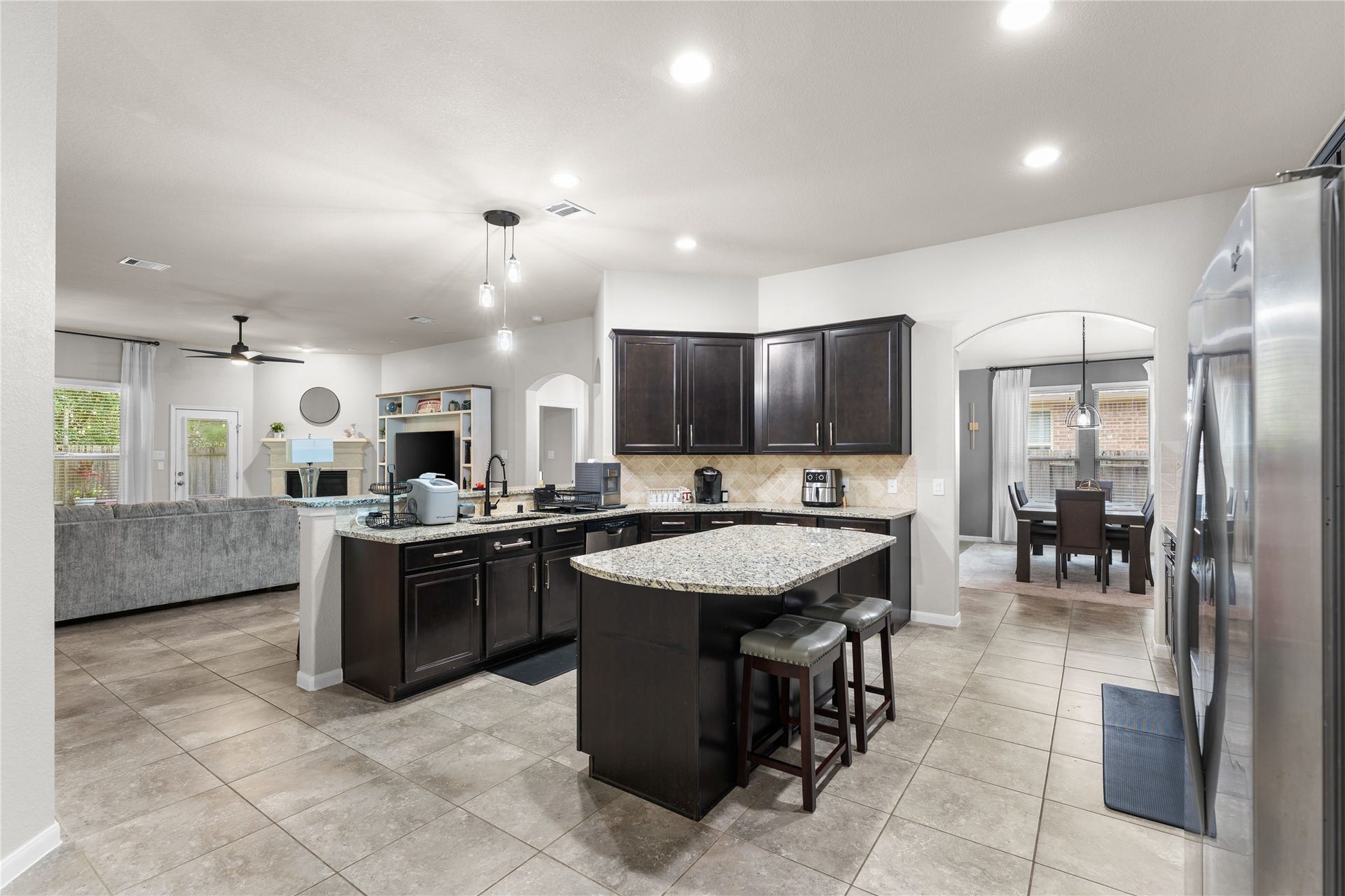 Open-concept design connecting the family room and kitchen for effortless entertaining.