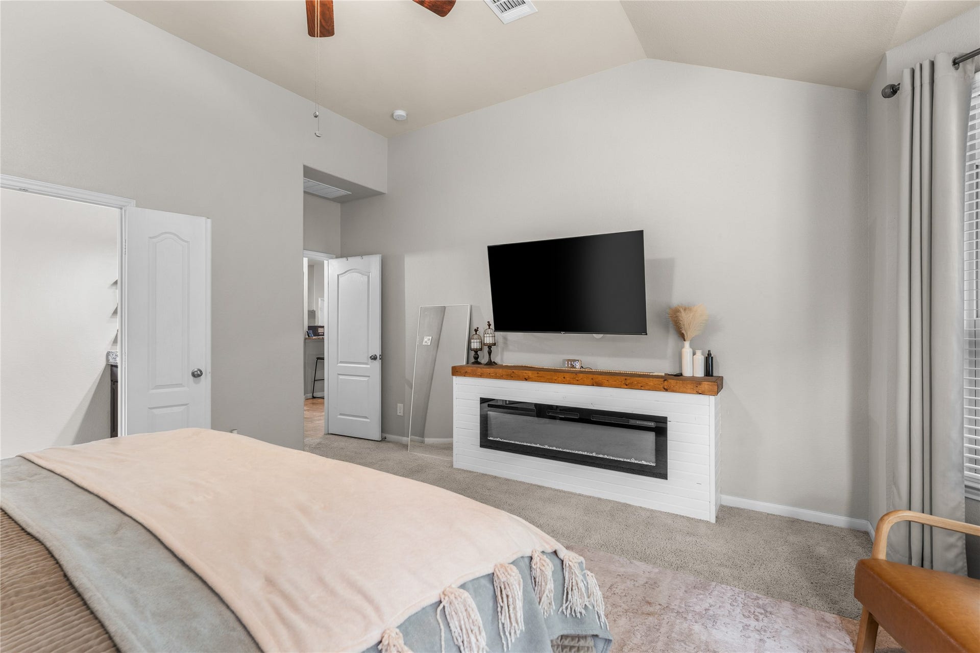 Alternate view of the primary suite highlighting generous room dimensions.