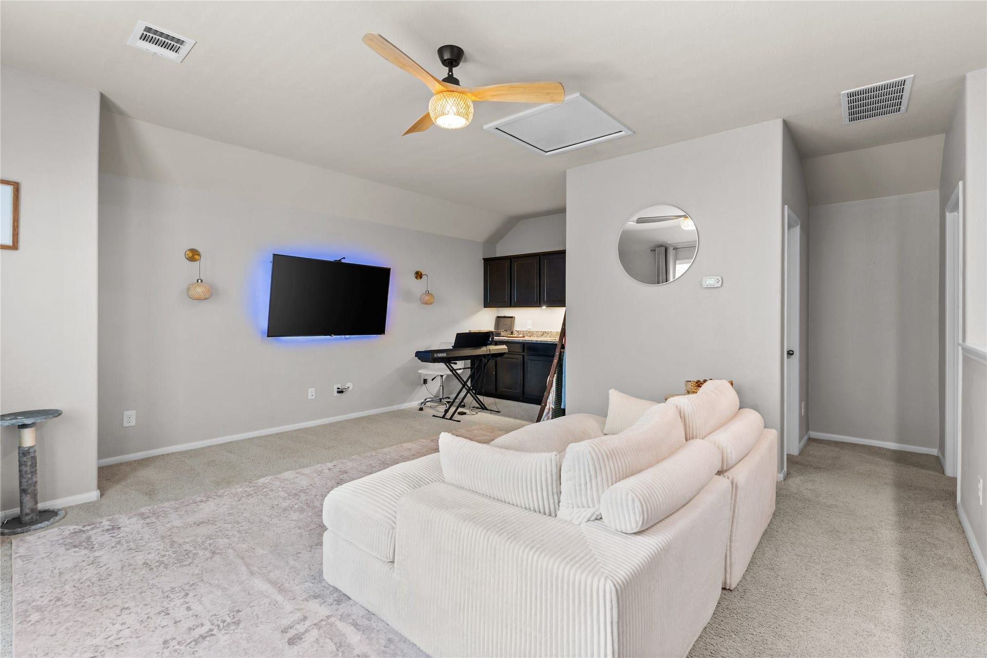 Flexible upstairs living area ideal for recreation, hobbies, or media use.