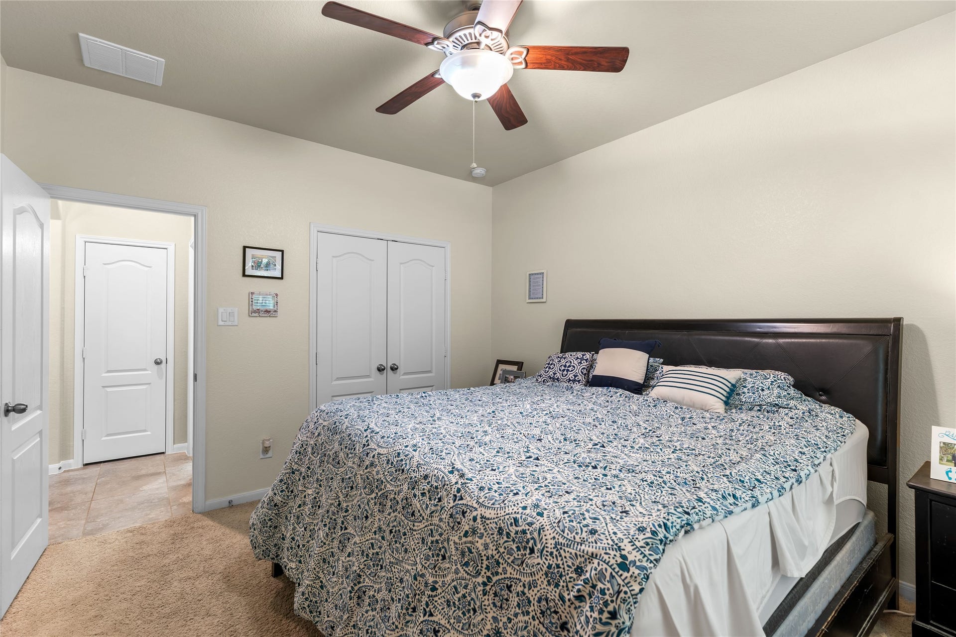 Alternate angle of the secondary bedroom with ample closet space.