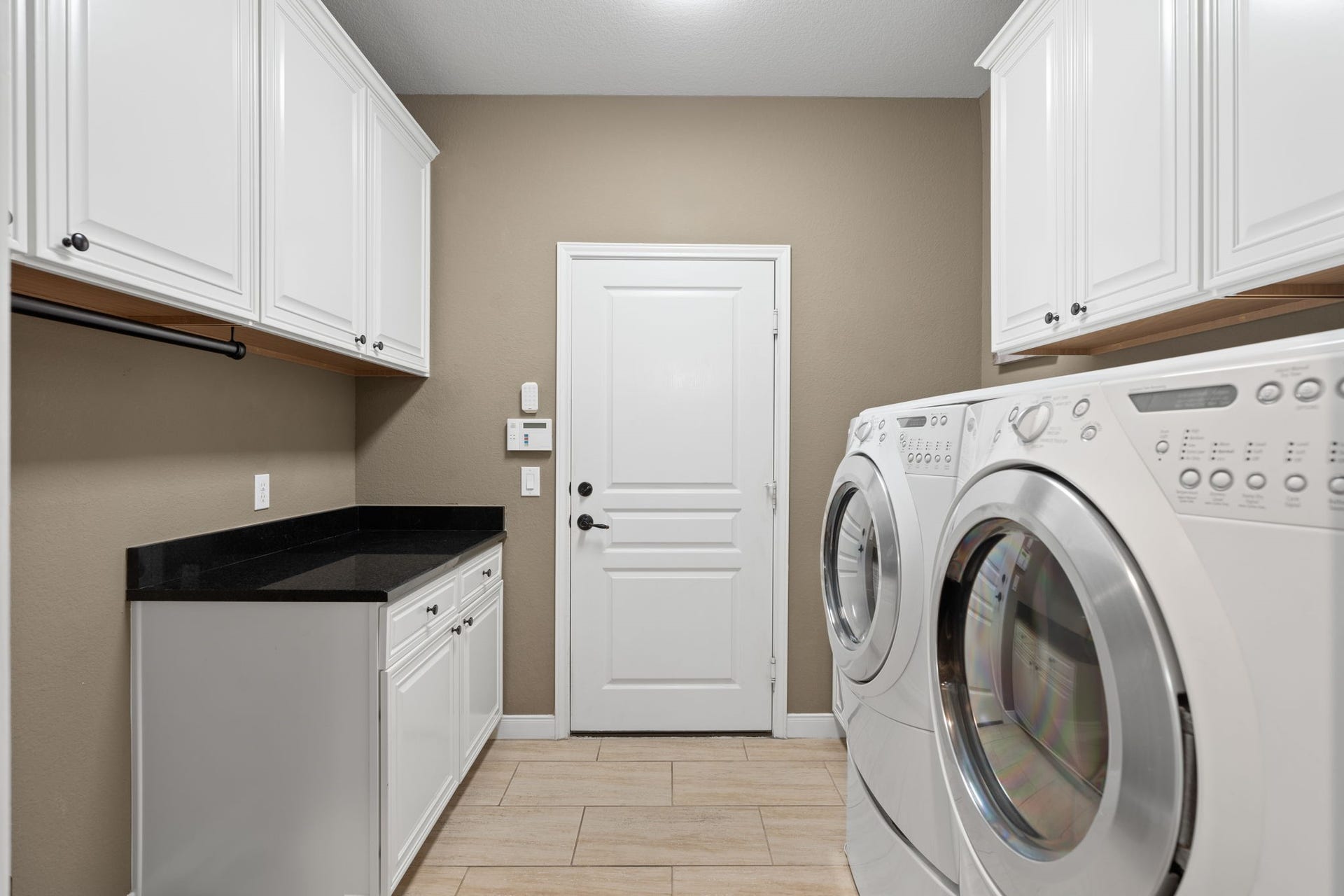 Cabinets provide ample storage, keeping the space clutter-free and organized.