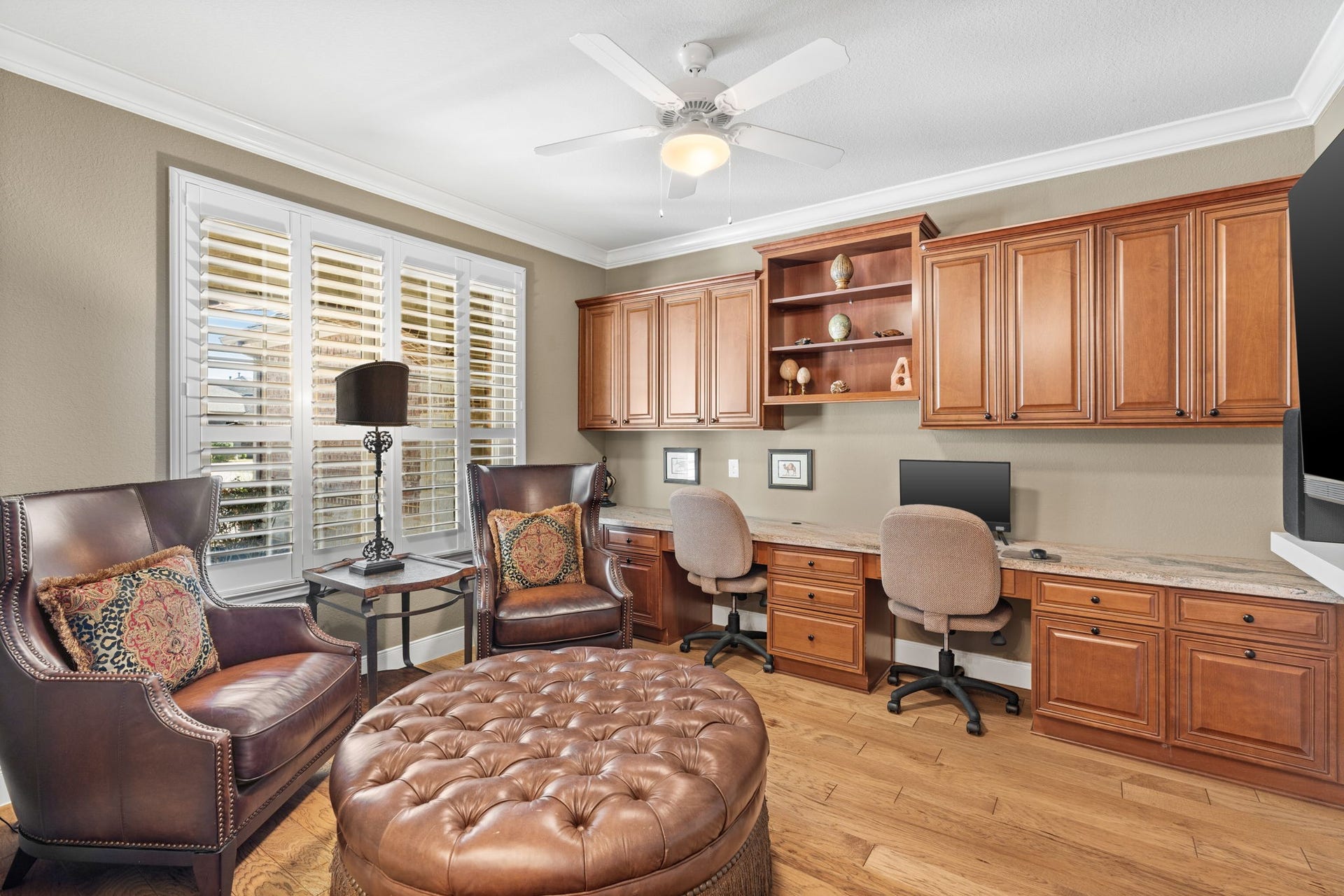 Enjoy beautiful natural scenery and watch hummingbirds dance around the garden this time of year - The study/office has custom built in cabinets, shelves and crown molding.