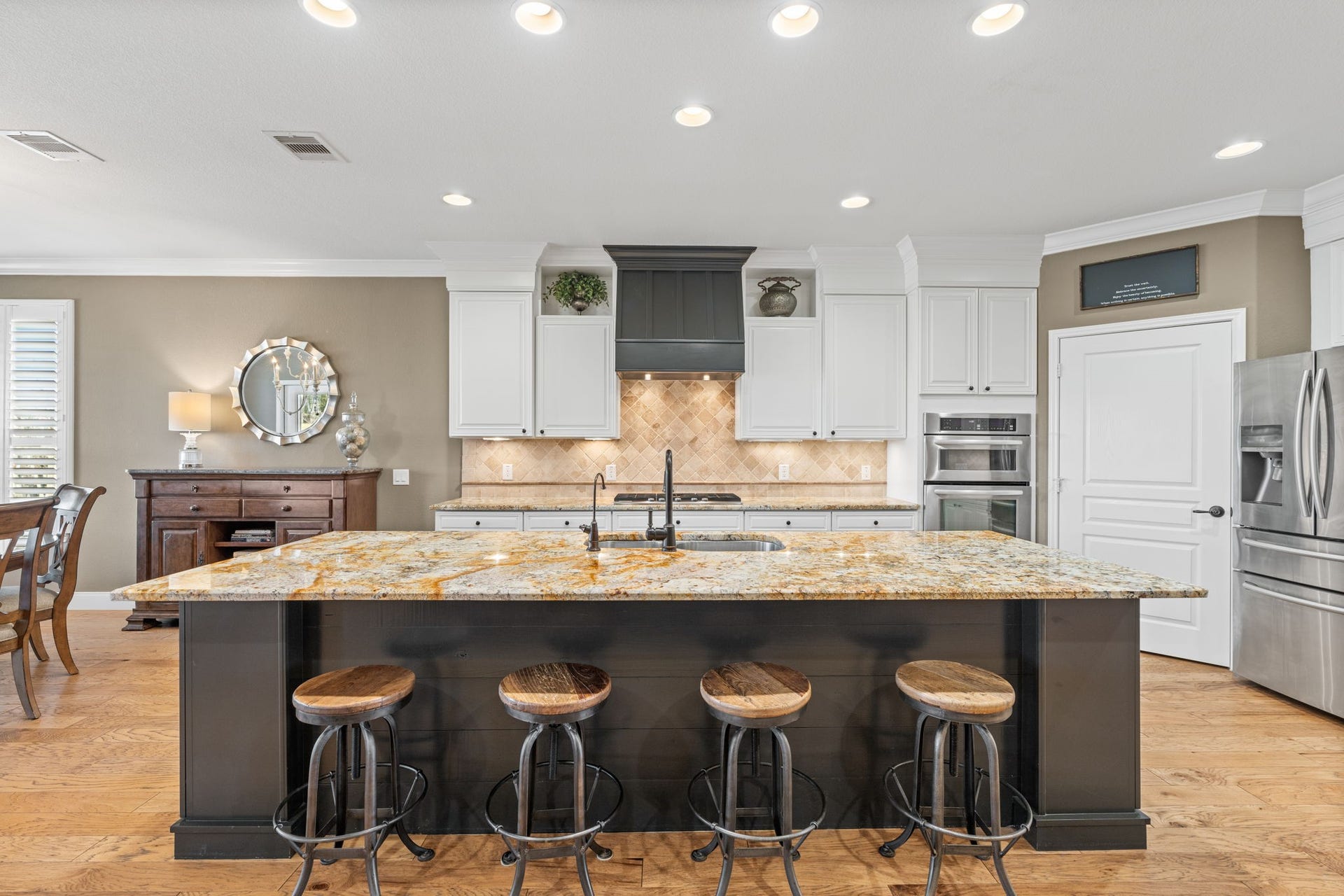 Prepare to be dazzled by the highest level of upgrades, meticulously applied to every feature, offering an unparalleled living experience.Stunning Wood hood with double crown molding