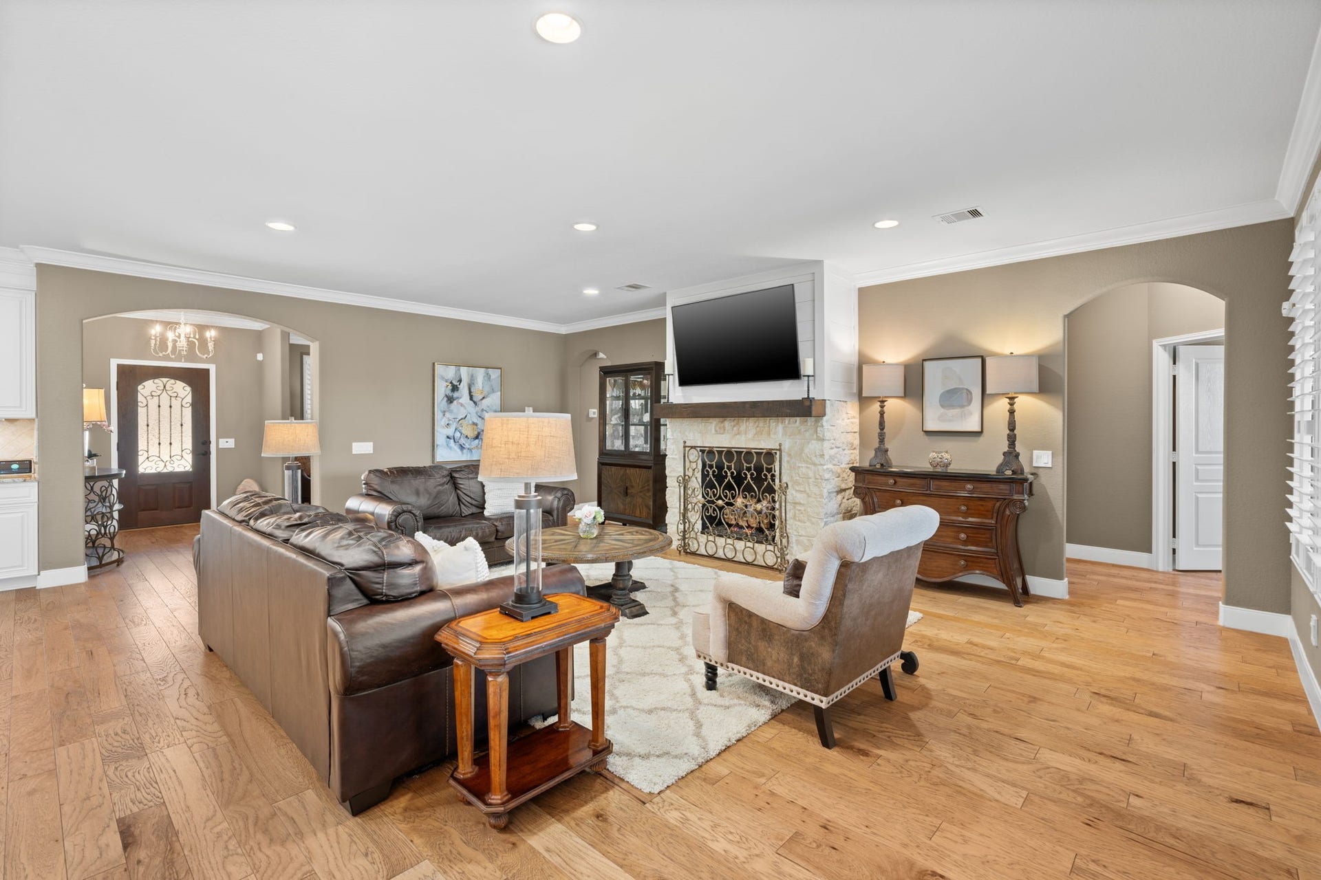 The wood flooring throughout is beautifully crafted and adds a touch of elegance.