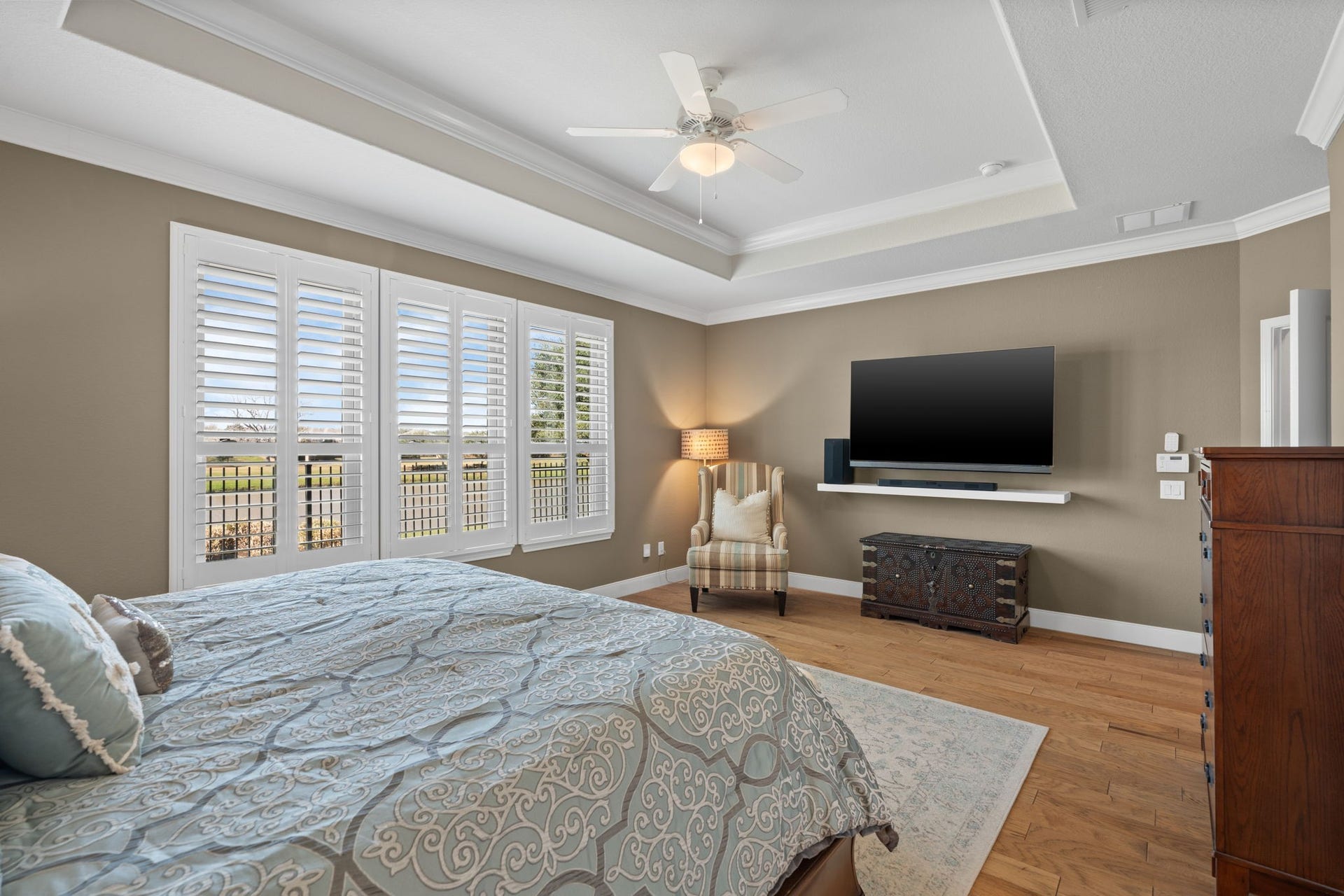 What truly sets this suite apart are the breathtaking views it offers. From its vantage point, you can gaze upon the serene water views and the majestic presence of mature trees. It's a vista that transforms this room into a haven of tranquility and natural beauty.