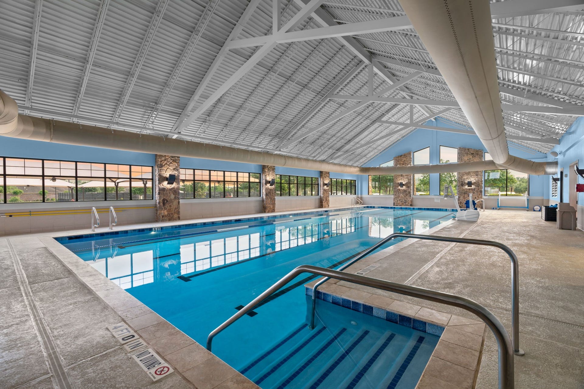 Luxuriate year-round with your own private, climate-controlled indoor oasis, featuring a soothing hot tub and a spacious heated pool.