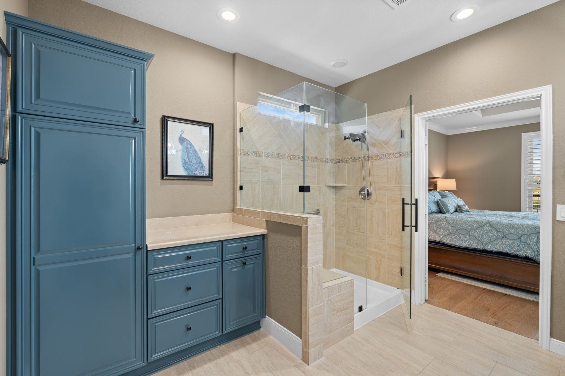 As you step into the shower, you'll appreciate the bench and handheld shower head, an exquisite touch that elevates the experience. It's a space where you can truly unwind and rejuvenate, as the stresses of the day melt away.