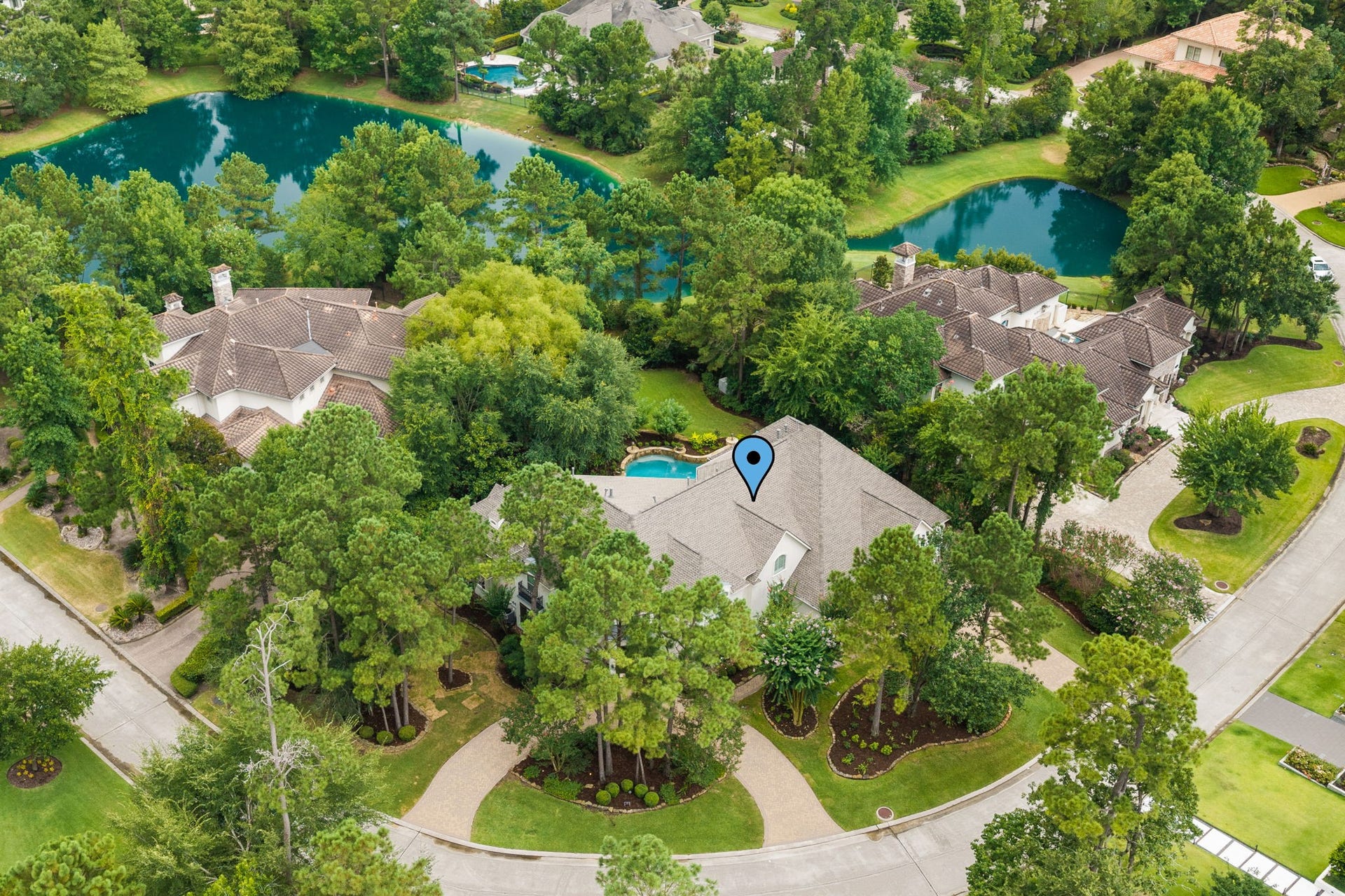 39 N Palmiera Circle, The Woodlands, TX 77382 Located on a quiet, oversized lot, this beauty enjoys backing to private lush landscape and one of the community ponds.