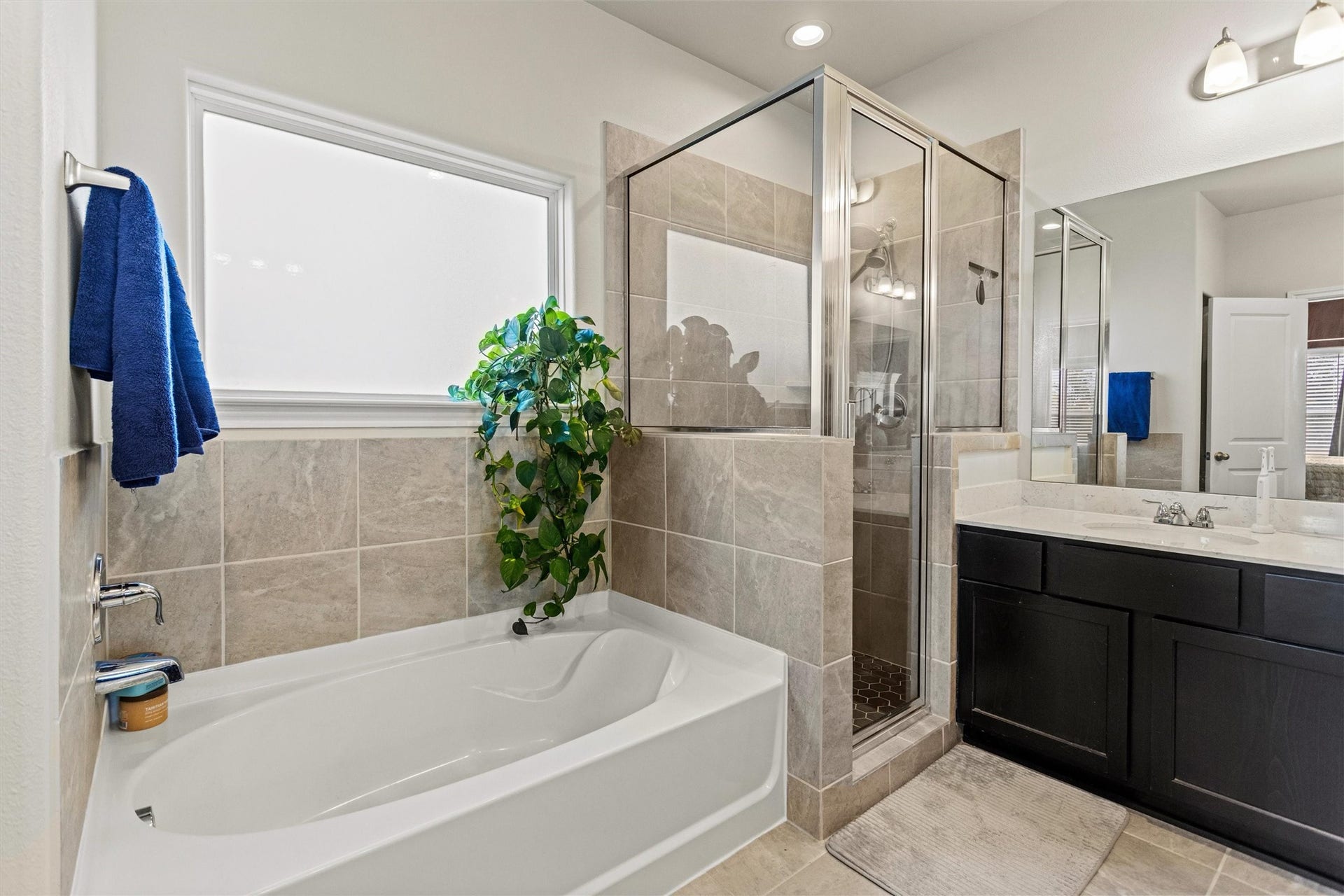 11731 Eclipse Drive, Willis, TX 77318 Features a separate shower and soaking tub.