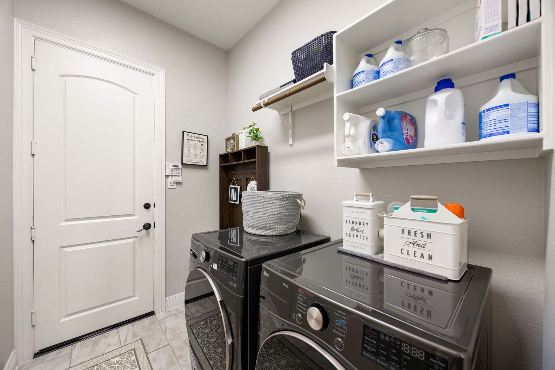 13522 Columbia Key Drive, Tomball, TX 77377 Designed with everyday function in mind, the laundry room offers upper storage, hanging space, and just enough room for added organization and mudroom-style convenience.
