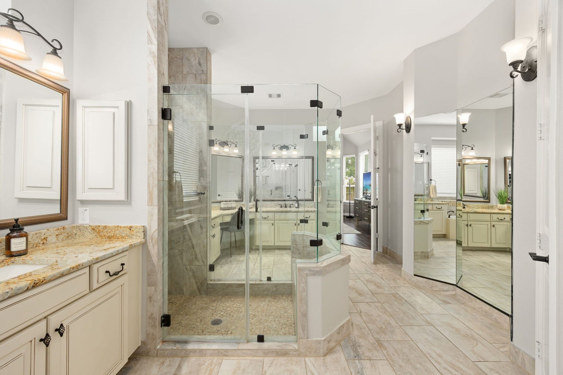13522 Columbia Key Drive, Tomball, TX 77377 From this angle, the primary bath showcases its large glass shower, mirrored dressing area, and seamless connection back to the primary suite.