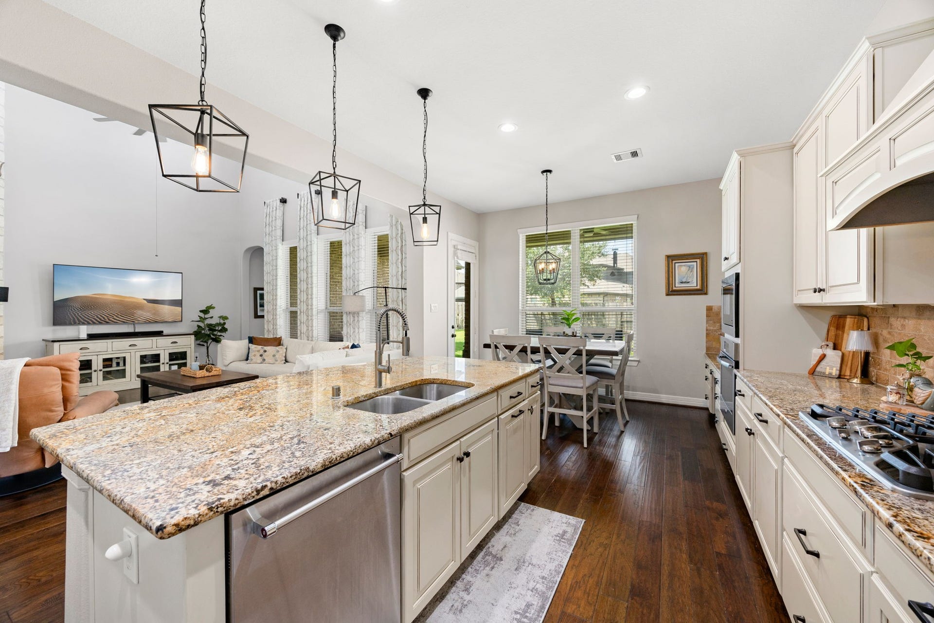 13522 Columbia Key Drive, Tomball, TX 77377 The spacious island takes center stage in this kitchen, offering generous prep space, added seating, and an open view to the breakfast area and living room.