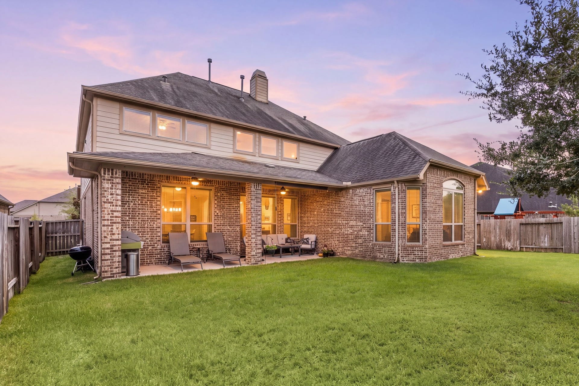 13522 Columbia Key Drive, Tomball, TX 77377 From this angle, the covered patio and side yard come together to showcase a backyard designed for both entertaining and everyday enjoyment.