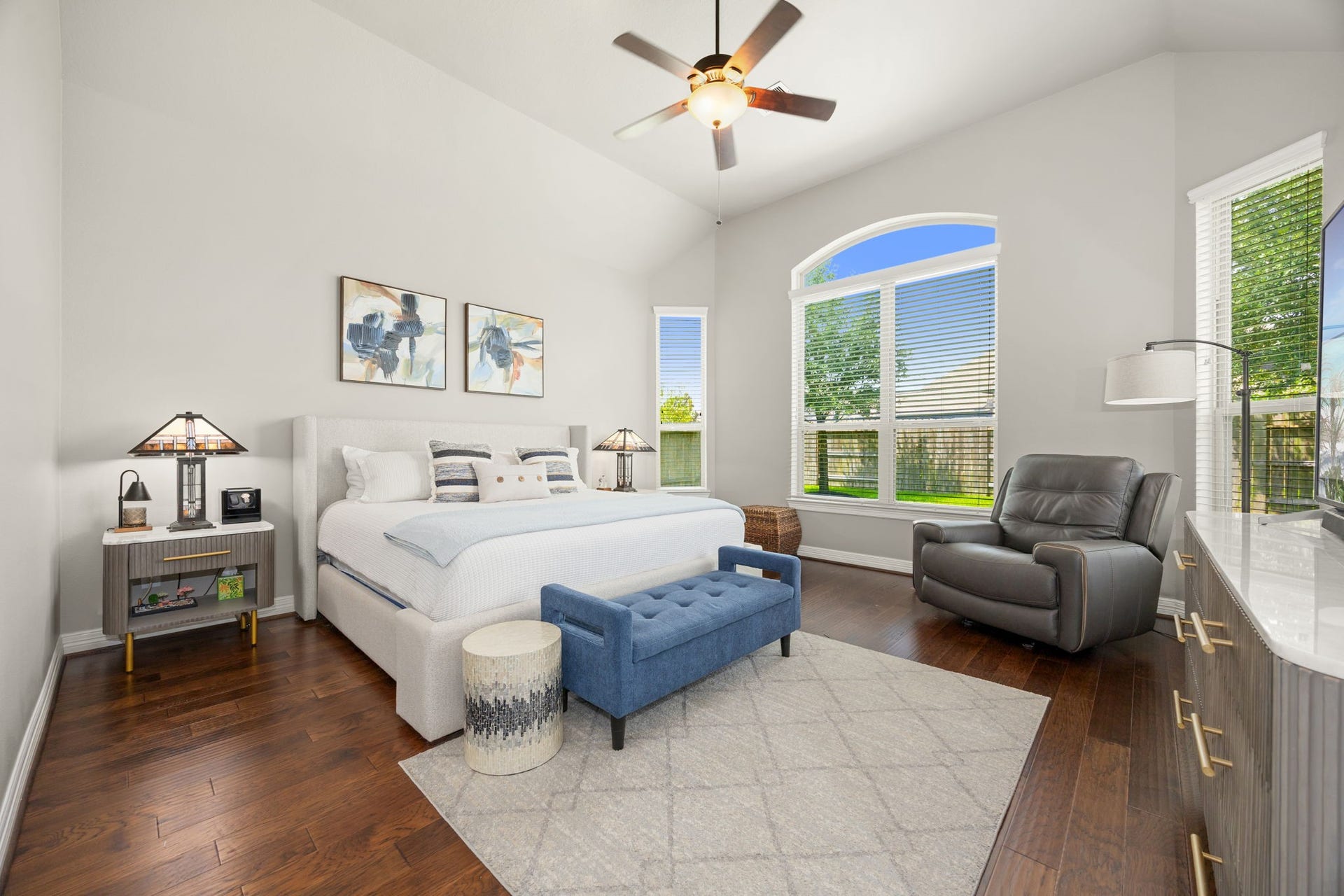 13522 Columbia Key Drive, Tomball, TX 77377 The primary suite feels bright and expansive, with high ceilings, abundant natural light, beautiful dark floors, and a seamless connection to the spacious primary bathroom.