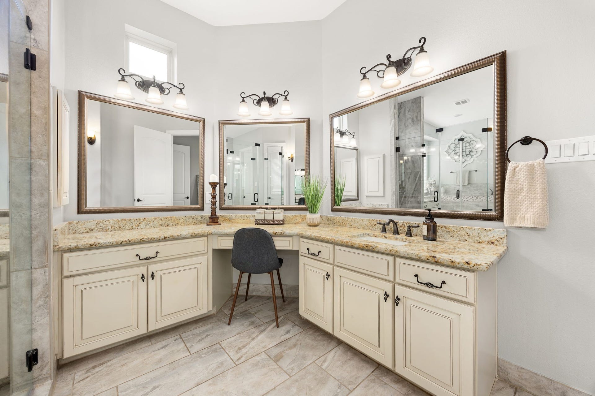 13522 Columbia Key Drive, Tomball, TX 77377 The oversized corner vanity offers exceptional counter space, multiple mirrors, and room for a seated vanity setup or daily getting-ready routine.