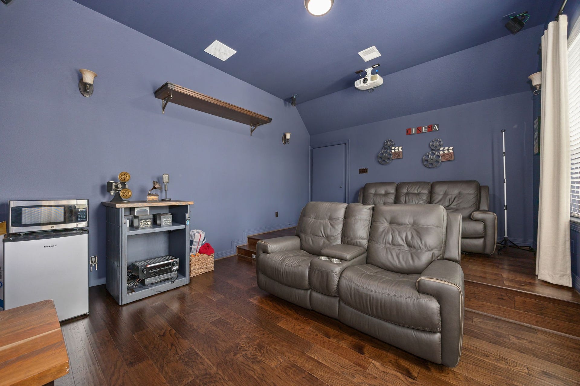 13522 Columbia Key Drive, Tomball, TX 77377 Designed for comfort and convenience, the tiered media room offers cozy seating plus space for a mini fridge, microwave, or snack setup to complete the viewing experience.