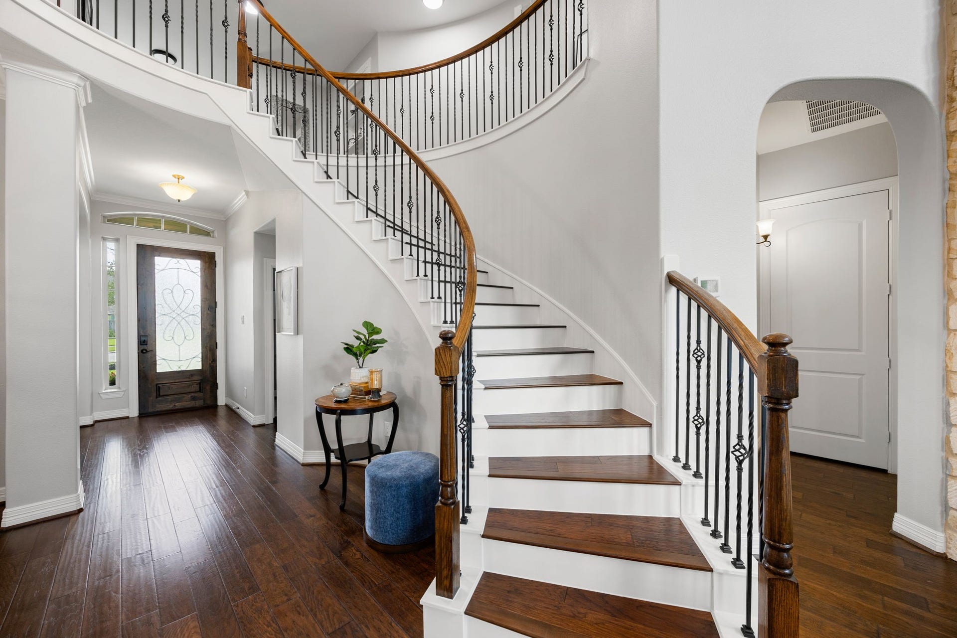 13522 Columbia Key Drive, Tomball, TX 77377 One of the first features to welcome you inside, the sweeping staircase makes a striking impression with elegant iron balusters and a graceful curve leading to the upstairs landing.