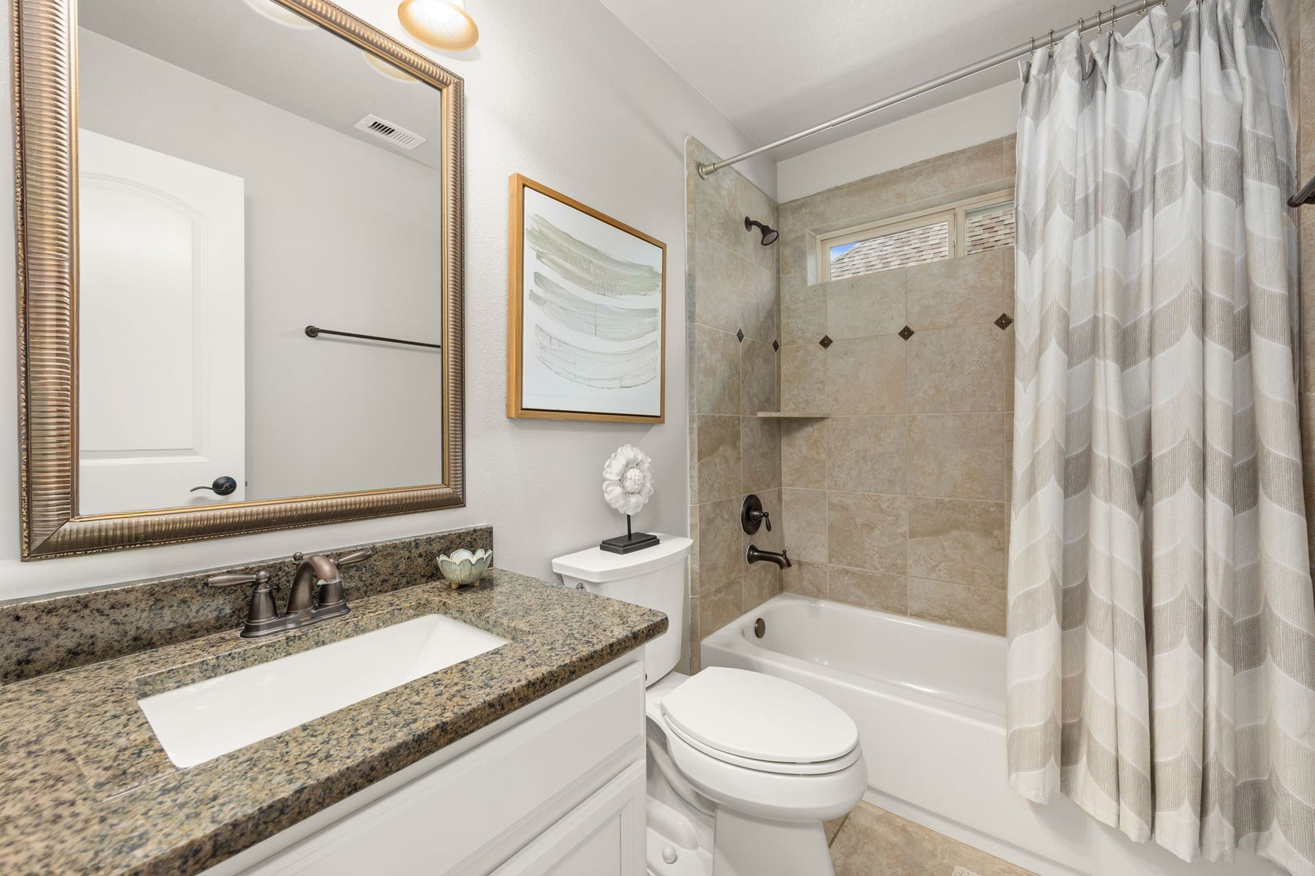13522 Columbia Key Drive, Tomball, TX 77377 This full bathroom offers a practical layout with updated finishes and everyday convenience for guests or family.