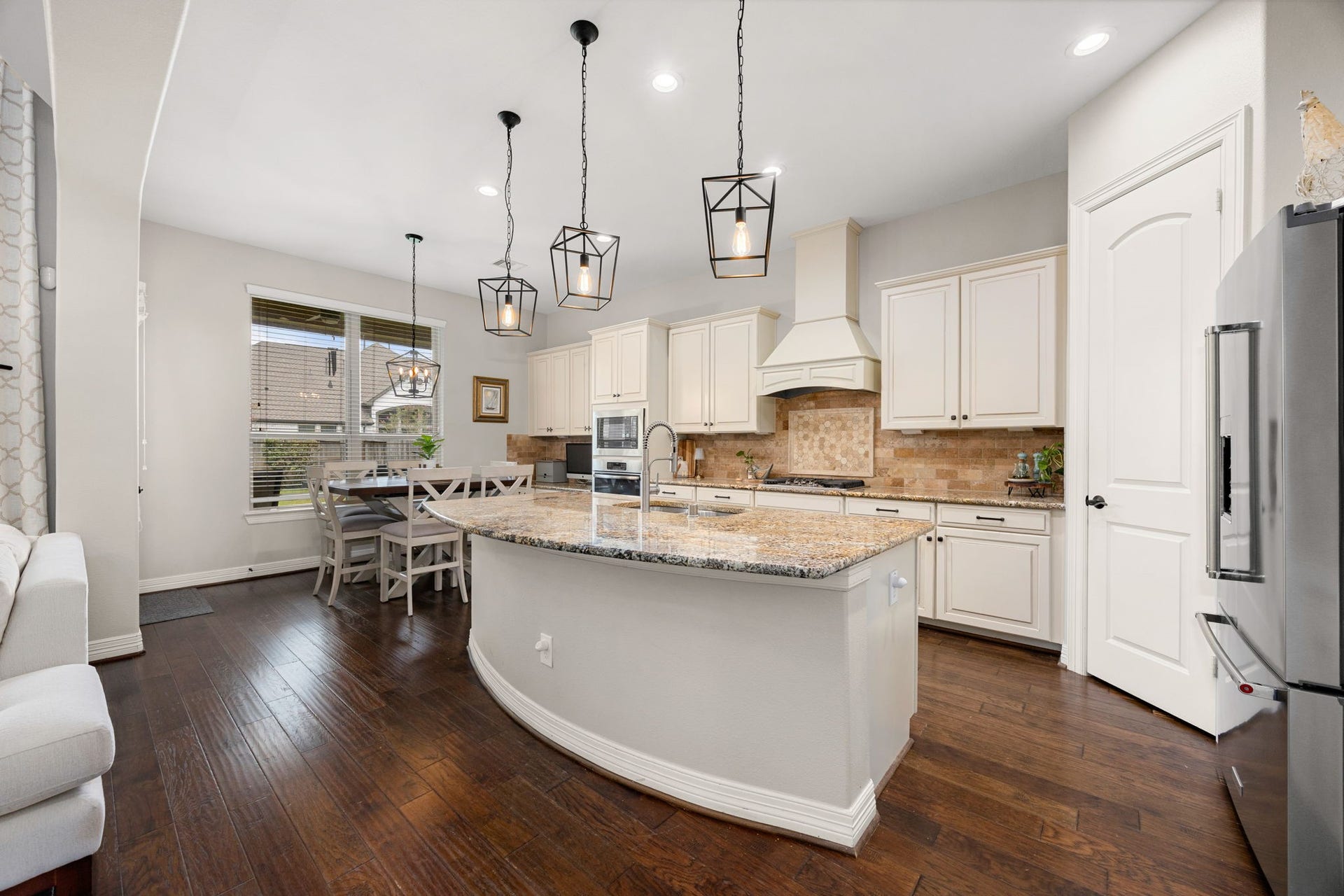 13522 Columbia Key Drive, Tomball, TX 77377 A wider view of the kitchen showcases the island, surrounding countertops, and bright breakfast area, giving a clear sense of the rooms spacious and practical layout.