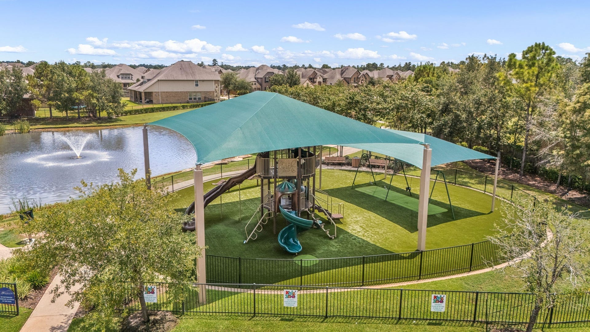 13522 Columbia Key Drive, Tomball, TX 77377 The large covered playground offers a shaded outdoor space for families to play and enjoy, especially during warm Houston days.