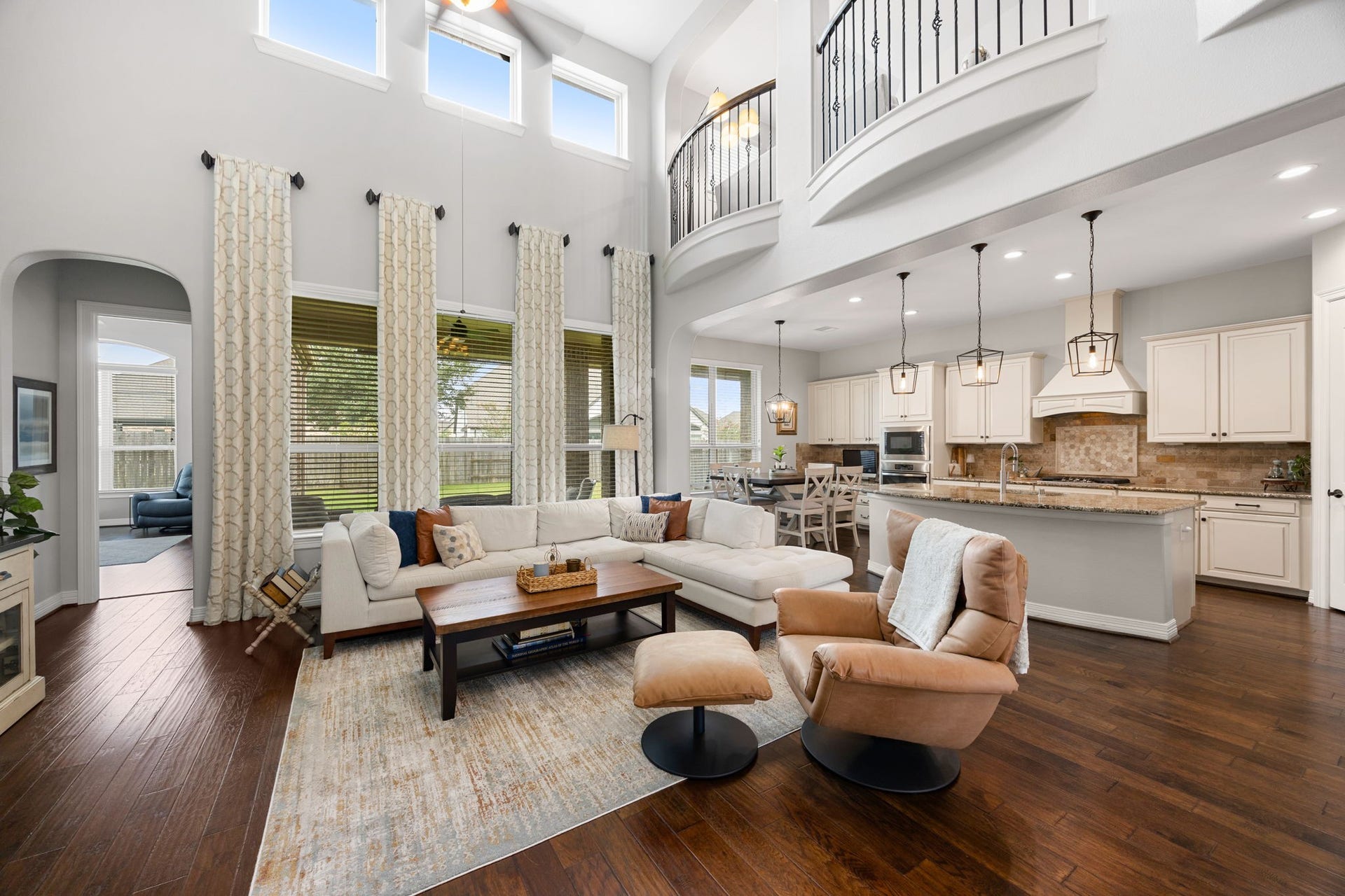 13522 Columbia Key Drive, Tomball, TX 77377 The living room offers an easy flow to the kitchen, breakfast area, and primary suite, while expansive backyard-facing windows keep the space bright and inviting.