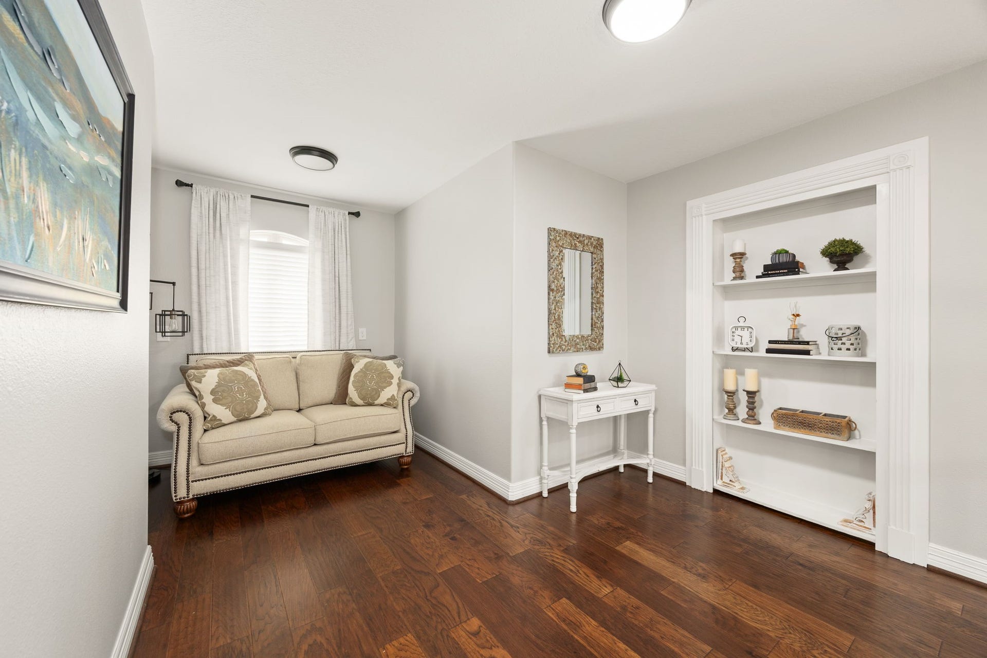 13522 Columbia Key Drive, Tomball, TX 77377 This upstairs sitting area adds even more flexible space, complete with a built-in bookcase that cleverly opens to the hidden media room beyond.