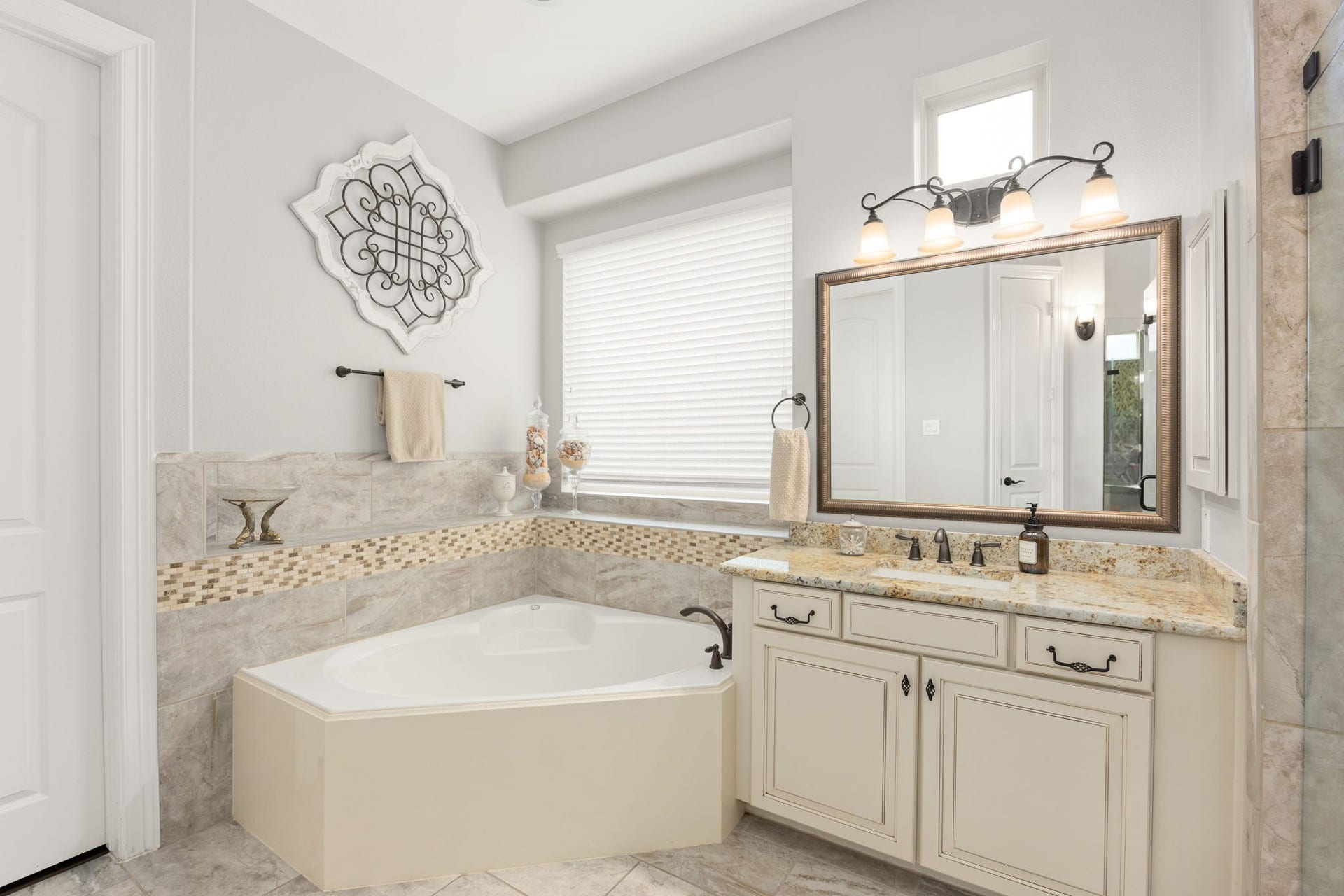 13522 Columbia Key Drive, Tomball, TX 77377 A corner soaking tub and additional vanity space create a spacious, functional layout with plenty of room to unwind and refresh.