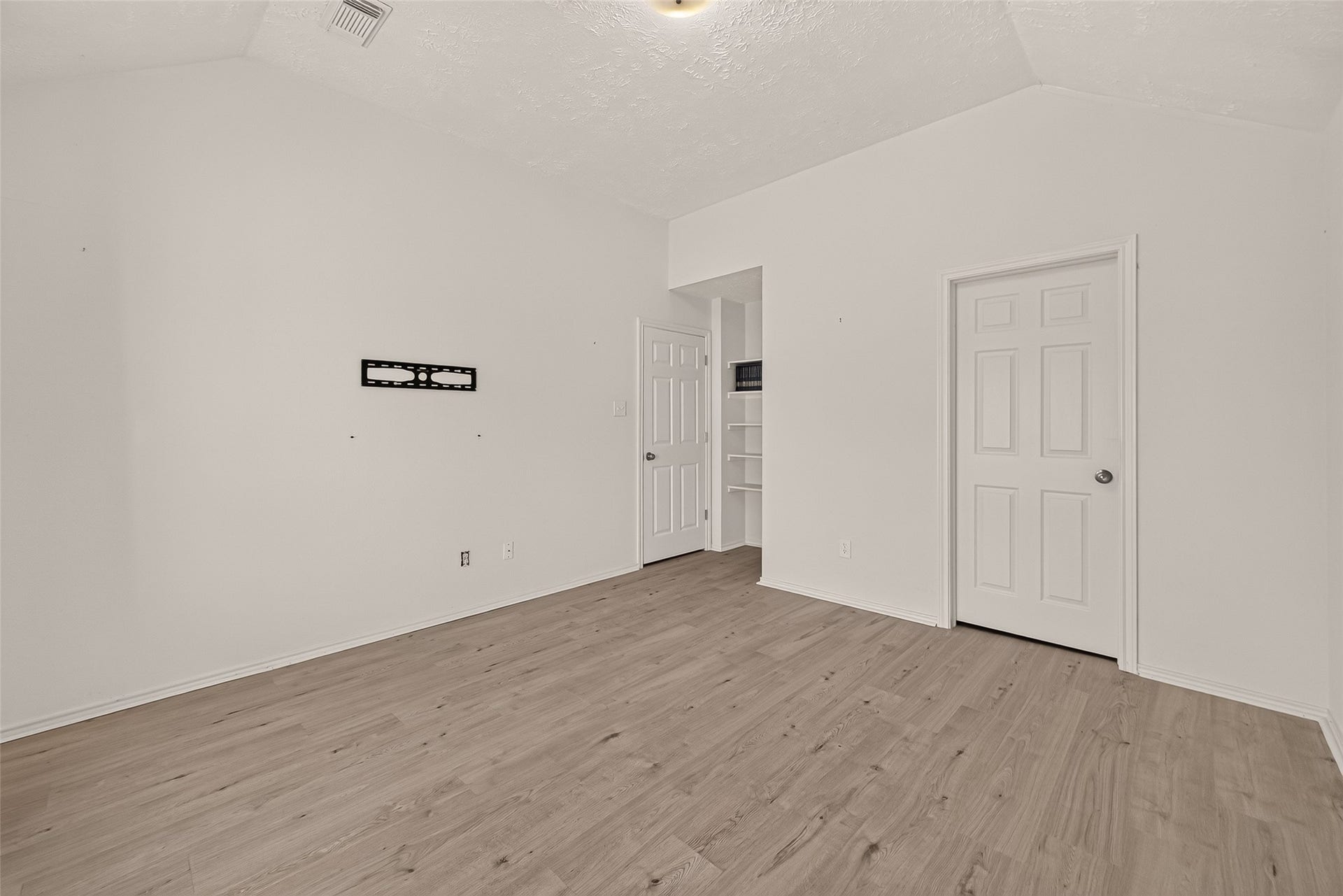 3356 Rachel Lane, Katy, TX 77493 A view of the built-in shelves and the door to both the hallway on the left and bathroom on the right.