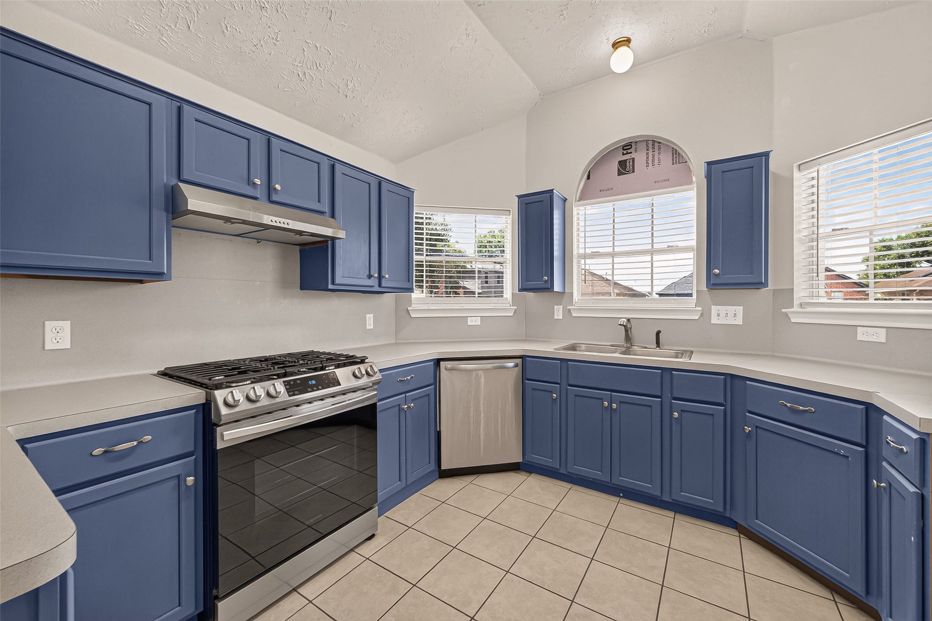 3356 Rachel Lane, Katy, TX 77493 Close up view of the range and the stainless-steel dishwasher. Plenty of counter space for prepping your favorite meals.