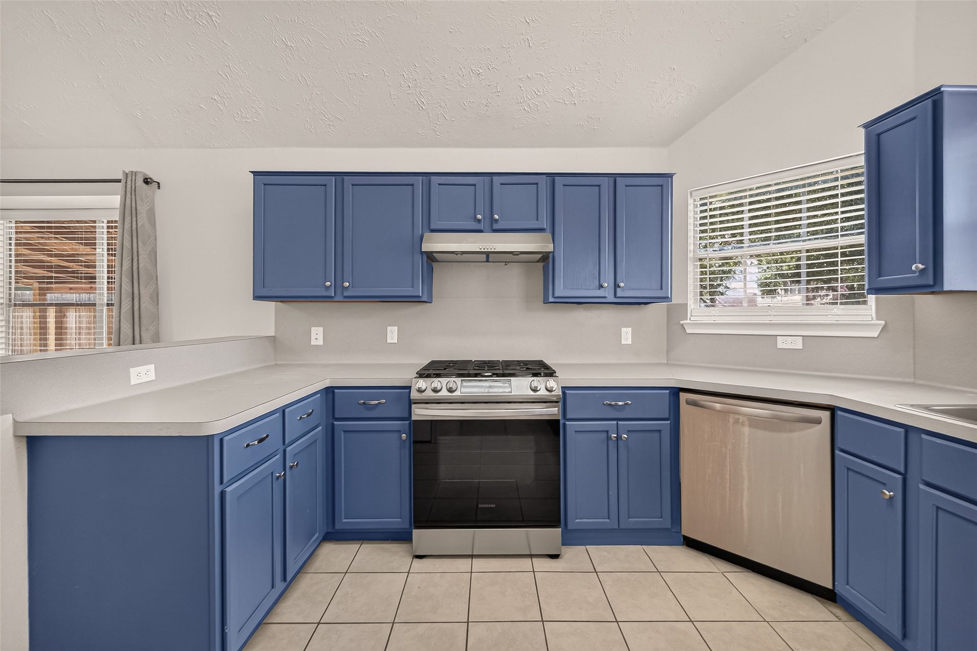 3356 Rachel Lane, Katy, TX 77493 Storage is easy to come by with upper and lower cabinets surrounding the entire kitchen area.
