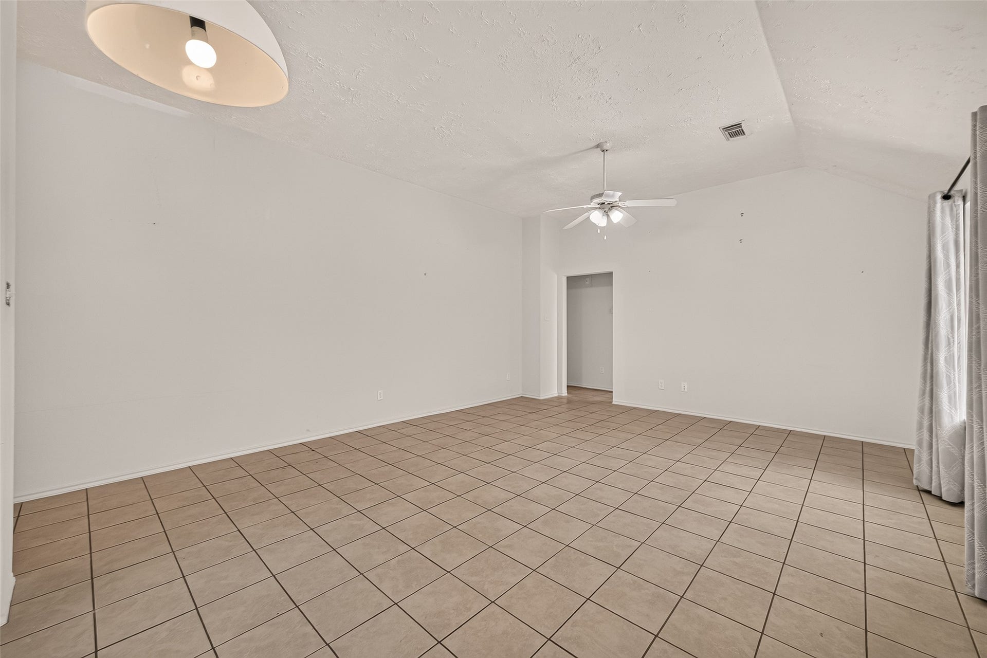 3356 Rachel Lane, Katy, TX 77493 A view of the living room from the kitchen entry way.