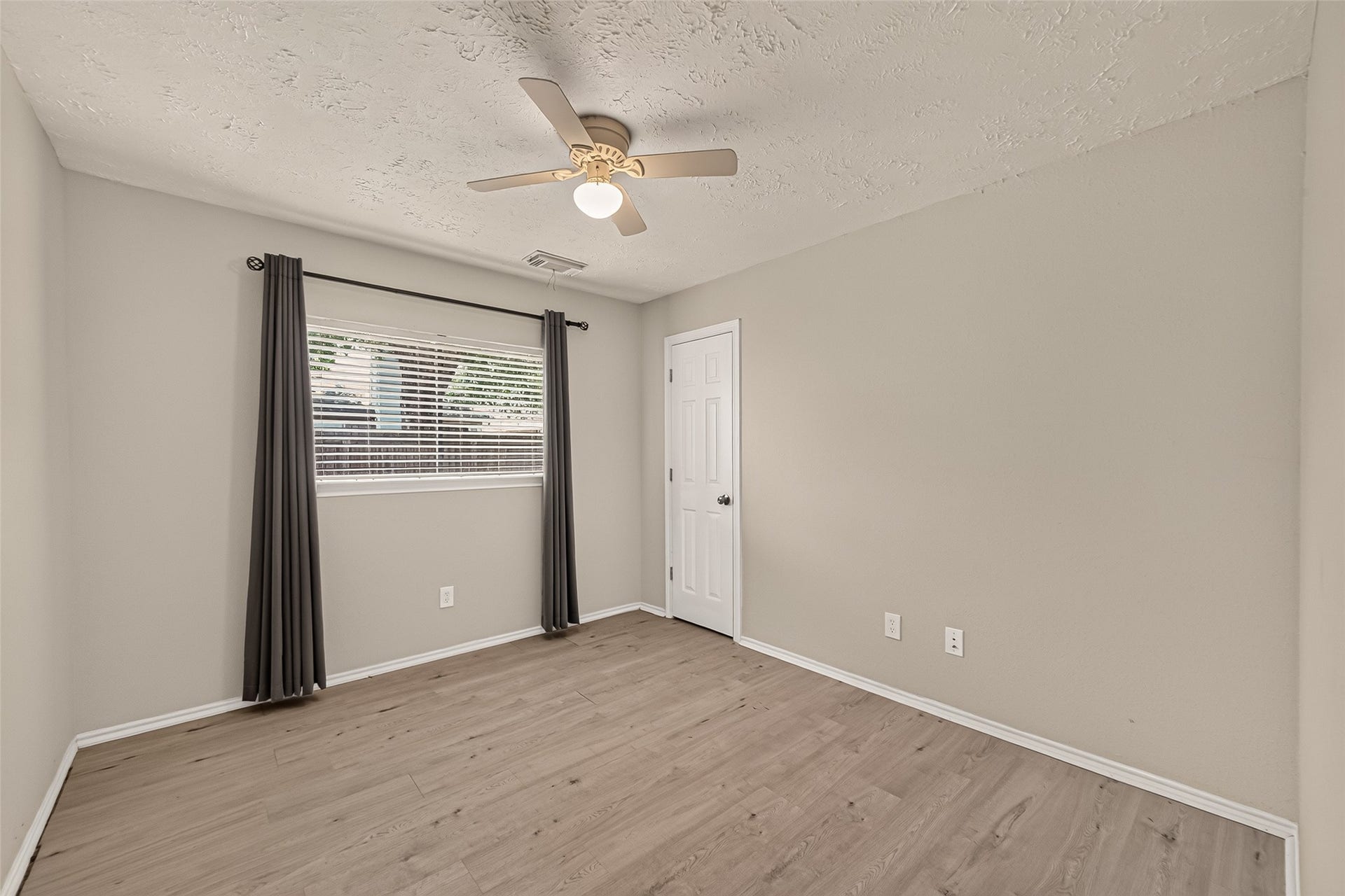 3356 Rachel Lane, Katy, TX 77493 The second bedroom with laminate flooring and a great closet. A beautiful view of the backyard.
