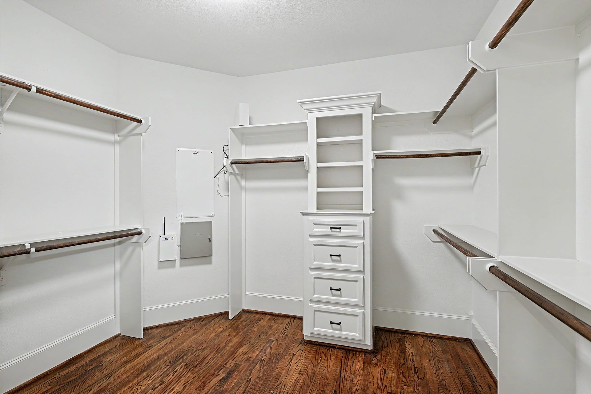 One of two walk-in closets for the primary bedroom.
