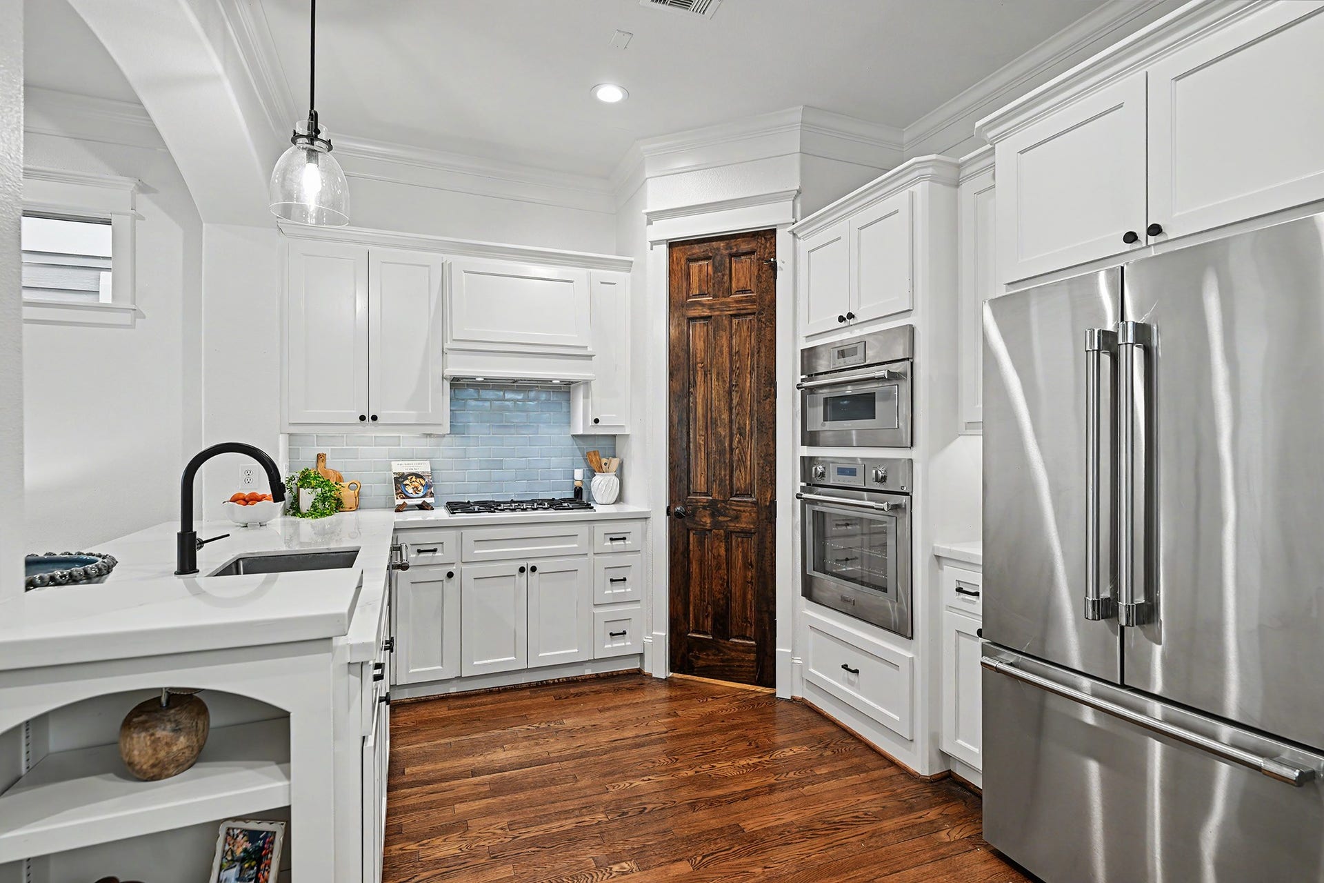 Gourmet kitchen offers quartz counter, stainless steel appliances (Thermador), soft close drawers/cabinets, exquisite backsplash and large walk-in pantry.