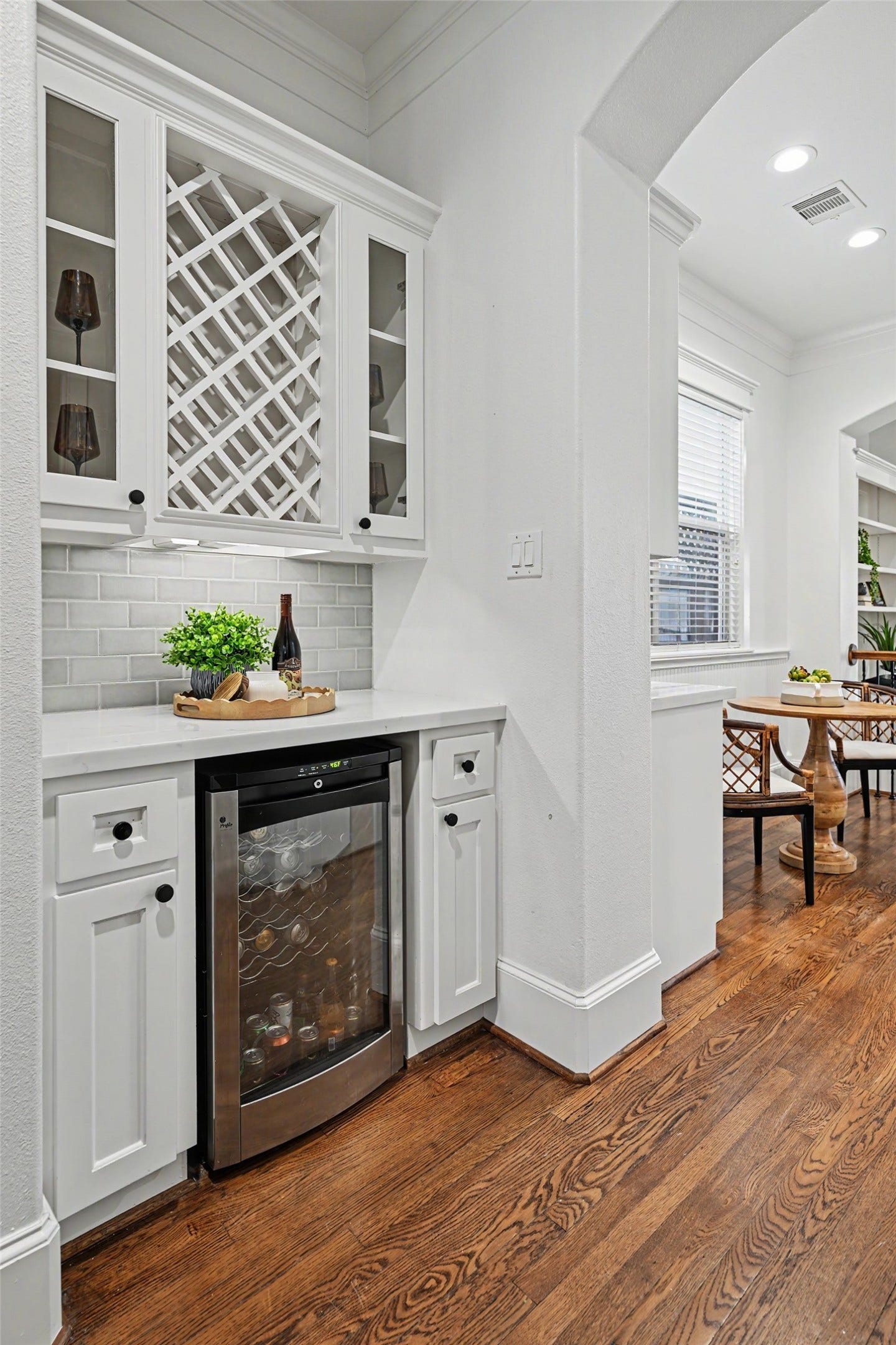 Butler's pantry with wine storage and cooler separates the front and back of the first floor.
