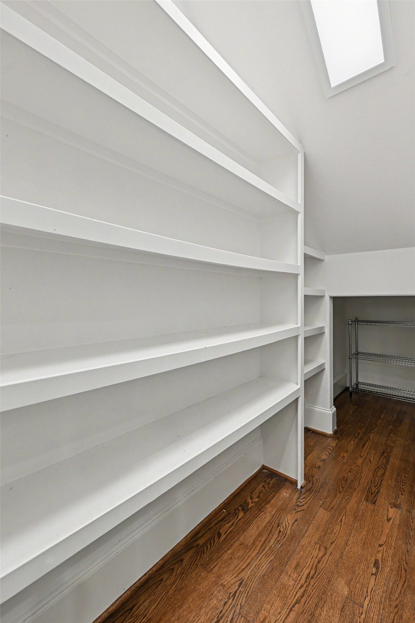 Large walk-in kitchen pantry.