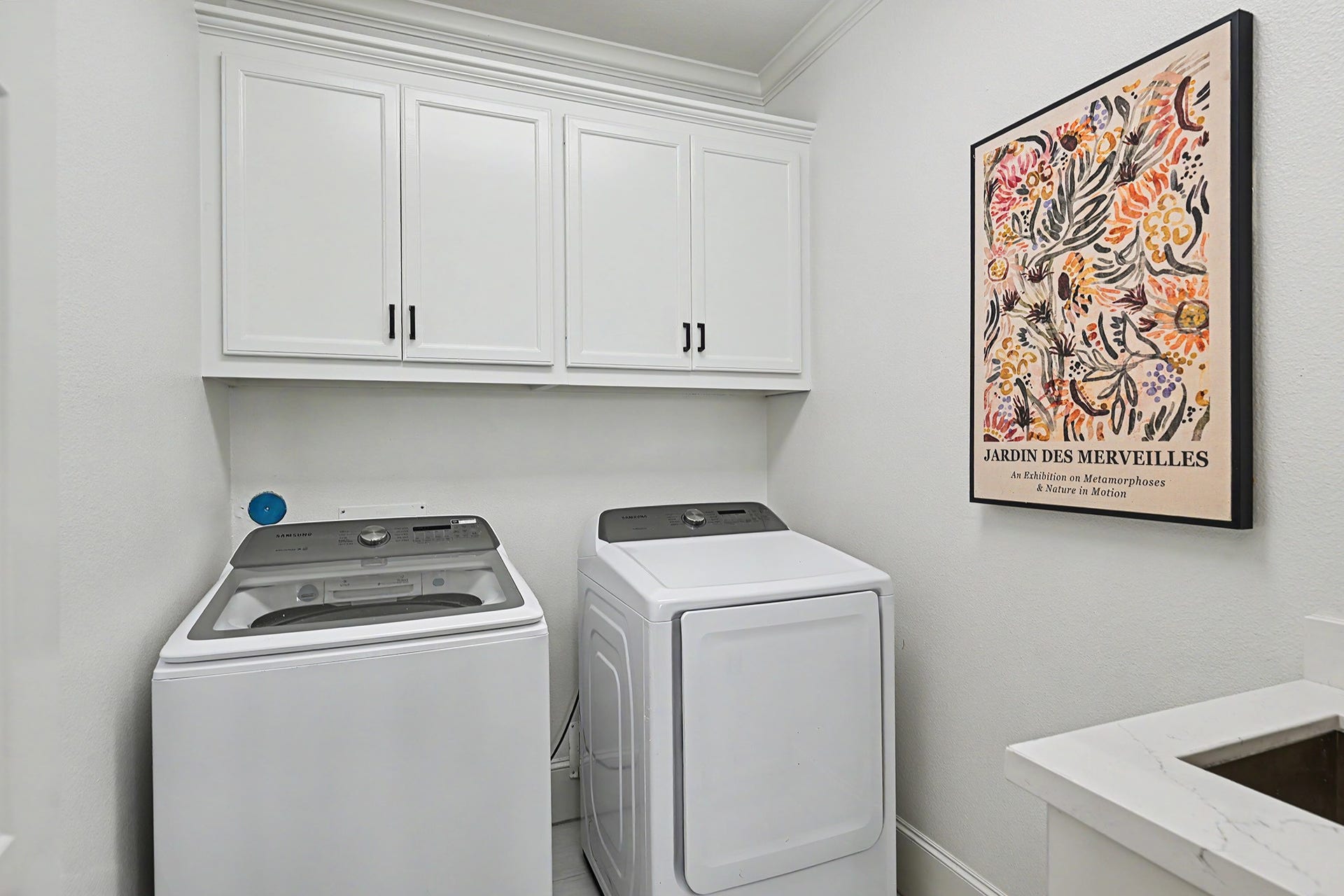 Upstairs laundry room includes a soaking sink.