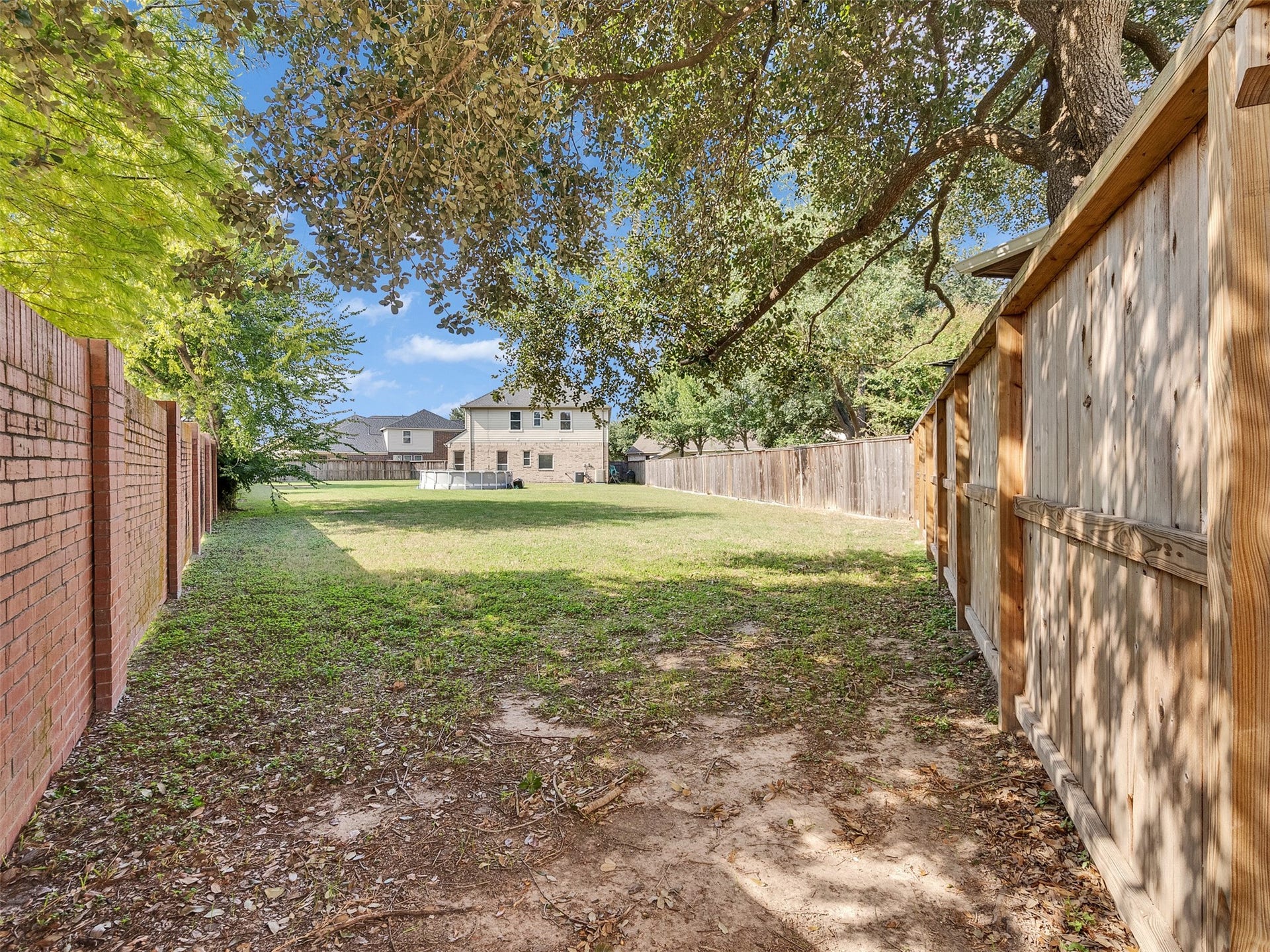 14102 April Glen Court, Cypress, TX 77429 The longest side of this massive back yard is a brick wall maintained by HOA. Complete privacy and minimal fence to replace if ever.
