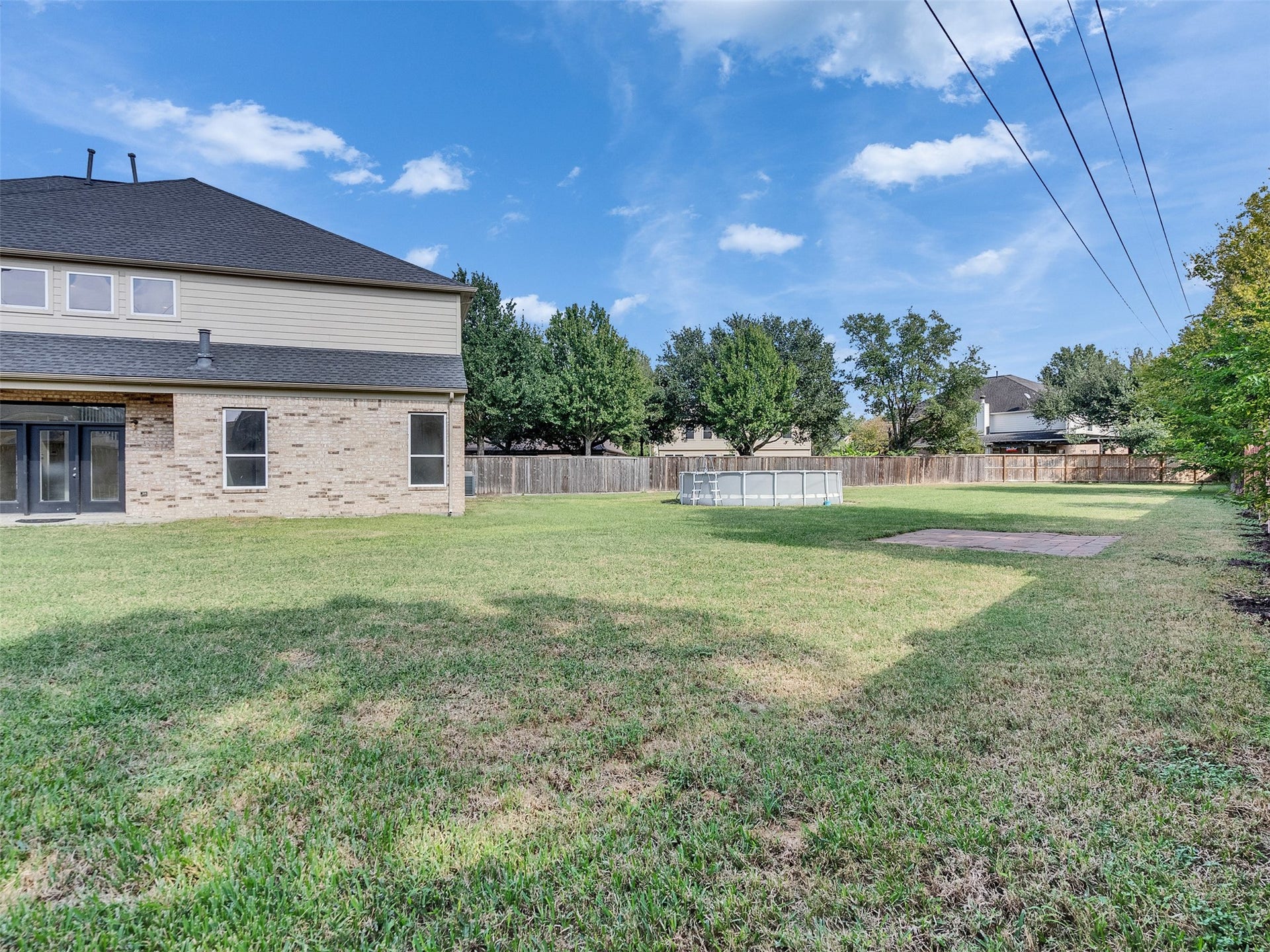 14102 April Glen Court, Cypress, TX 77429 Just imagine a beautiful patio or pool in this area right off the livingroom