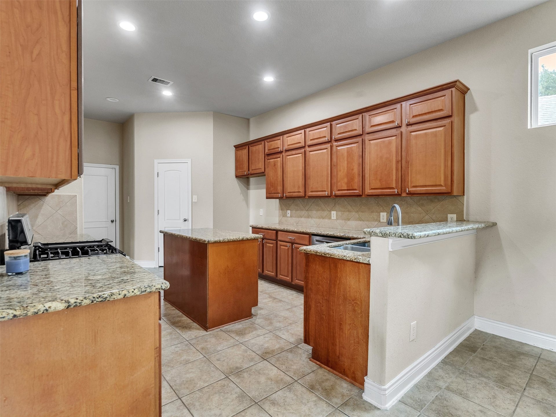 14102 April Glen Court, Cypress, TX 77429 Well appointed kitchen with granite and stainless appliances PLUS walk in pantry