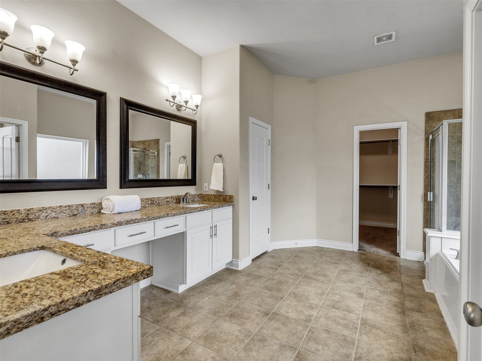 14102 April Glen Court, Cypress, TX 77429 Primary bath is oversized with double sinks and plenty of room for multiple people to get ready for the day.