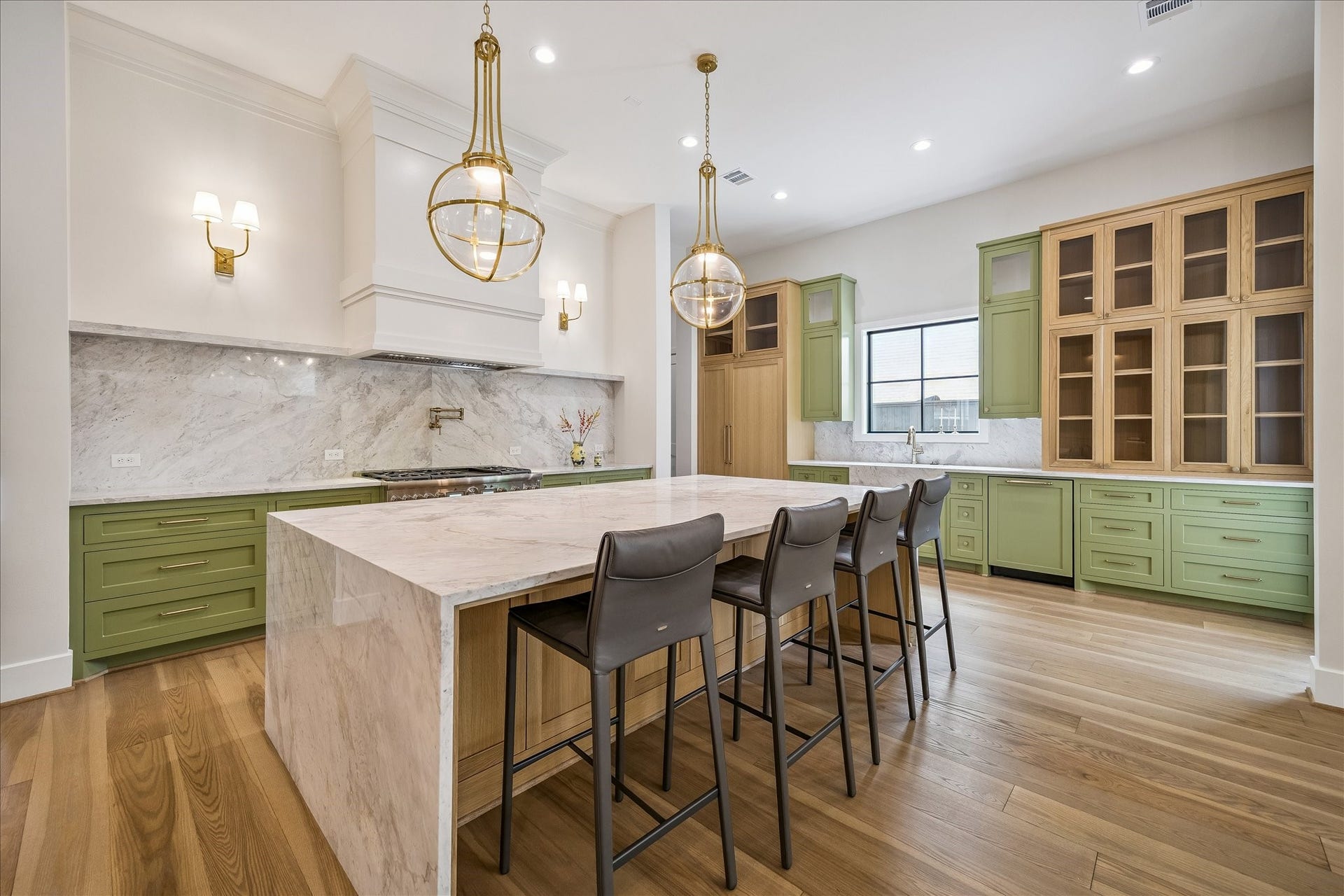 830 Azalea Street, Houston, TX 77018 Chefs kitchen offers a Montebello stone island and a full Thermador suite with a 48-inch Pro Grand range, panel-ready columns, and a built-in coffee system.
