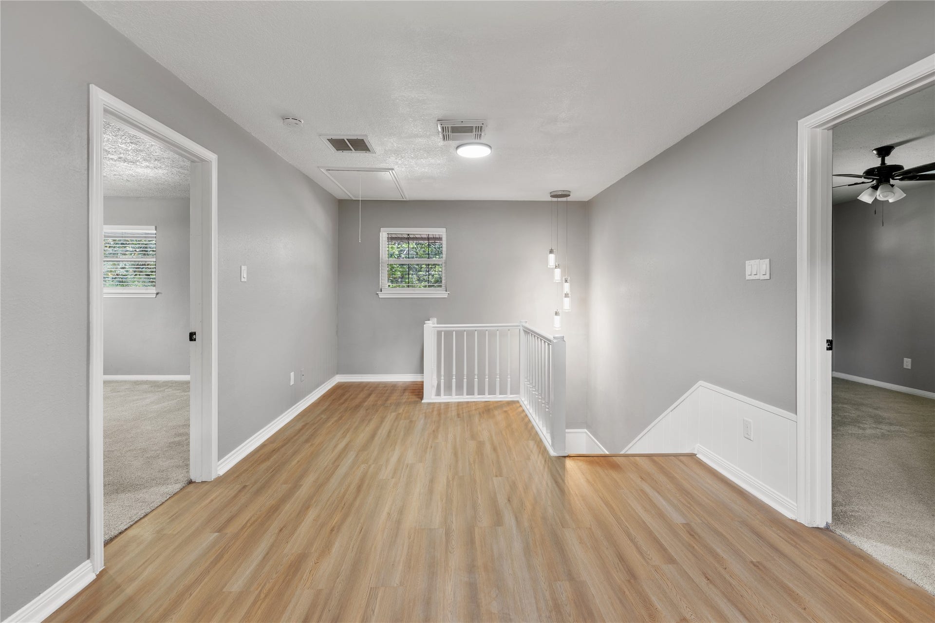 207 Burgundy Lane, League City, TX 77573 The second floor features another ample flex space, ideal for a game room or family living.
The statement lighting fixture over the staircase brings a touch of modern sophistication.