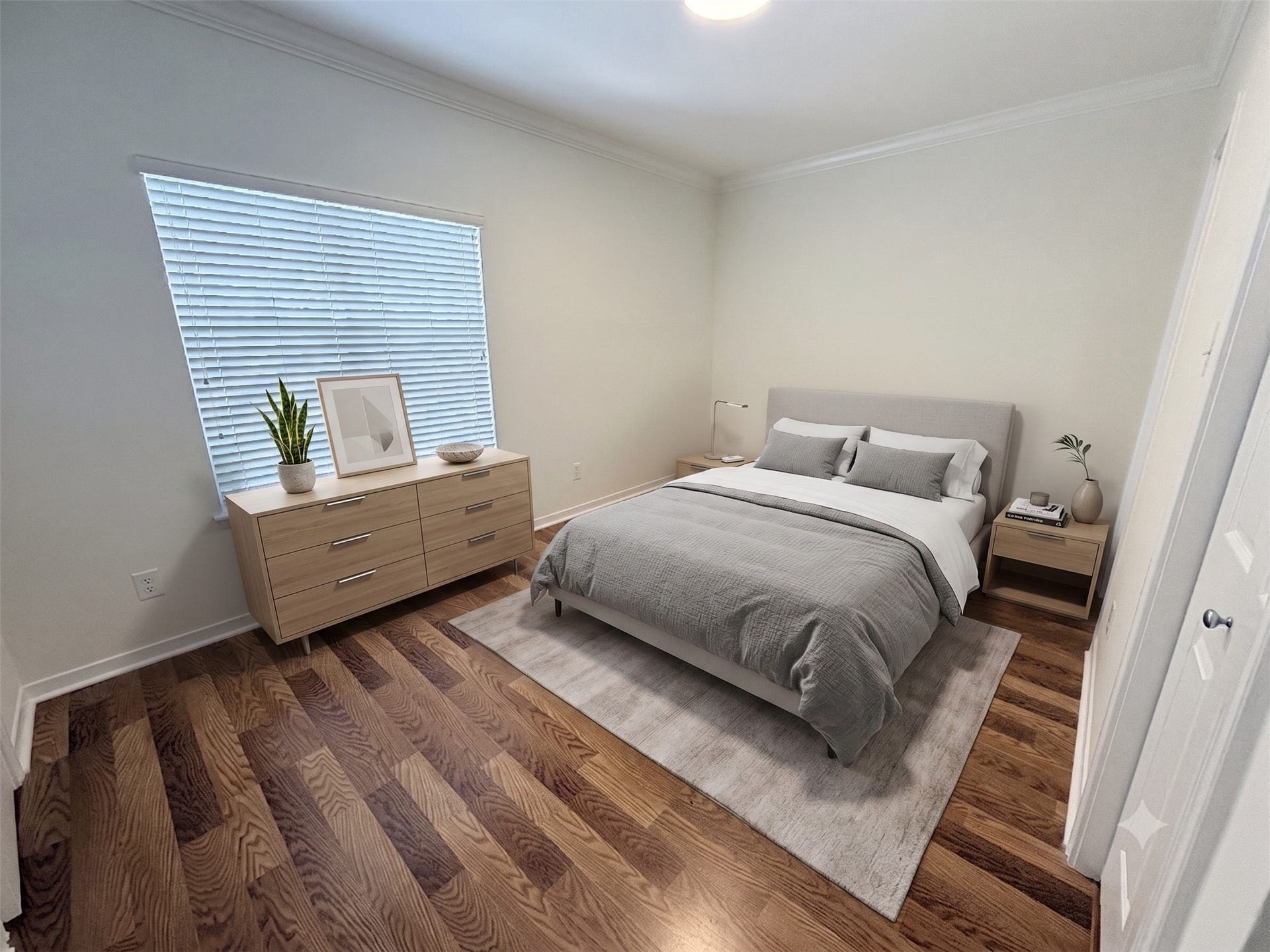 The primary bedroom features vinyl plank flooring, full walk in closet, & ensuite bath. Virtually staged