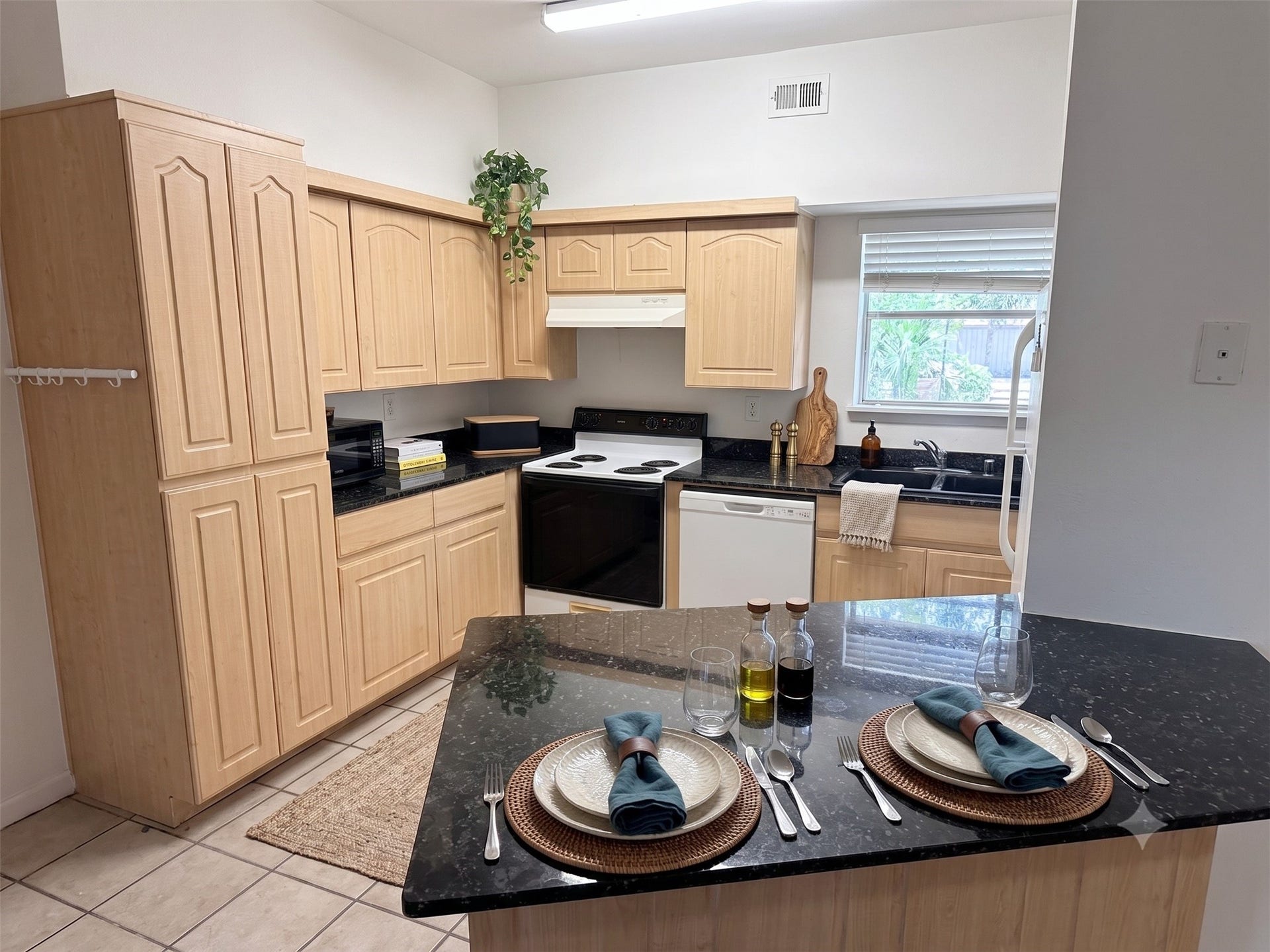 Breakfast bar area leading into the kitchen