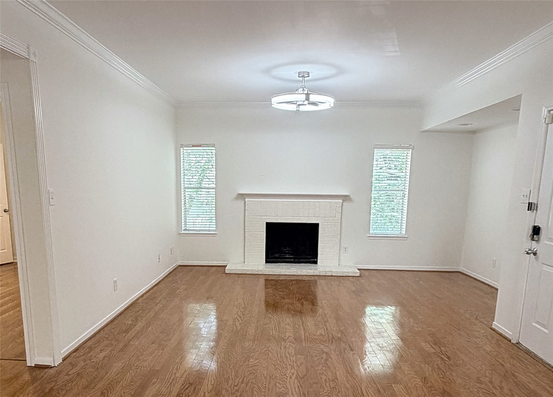 A wood burning fireplace makes a lovely focal point in the living room.