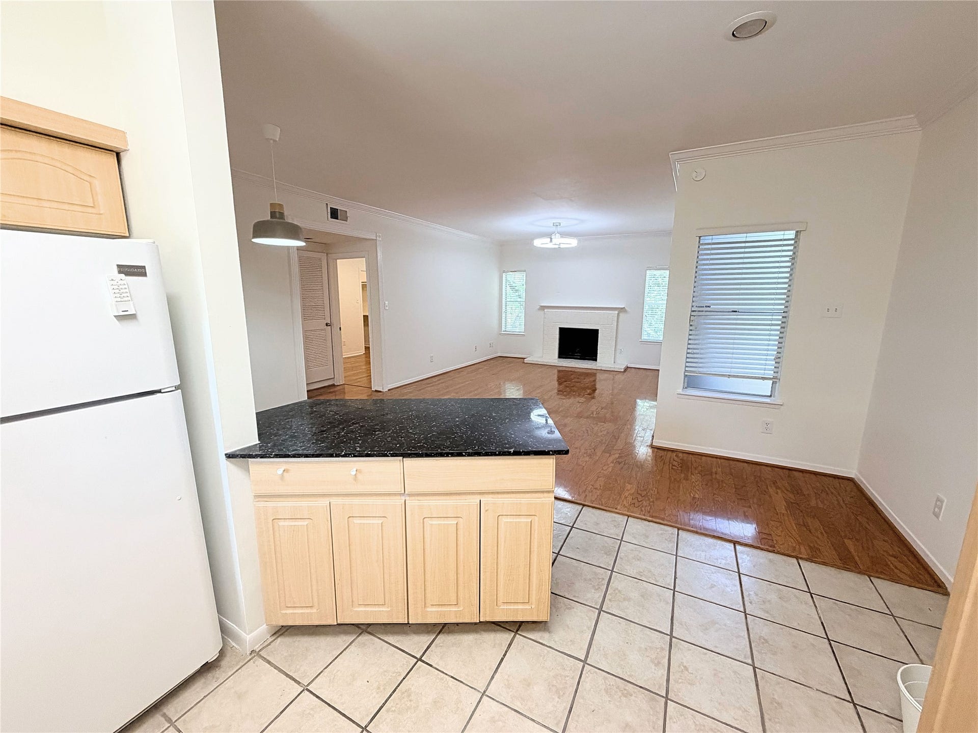 Open floorplan looking from the kitchen to the living room.